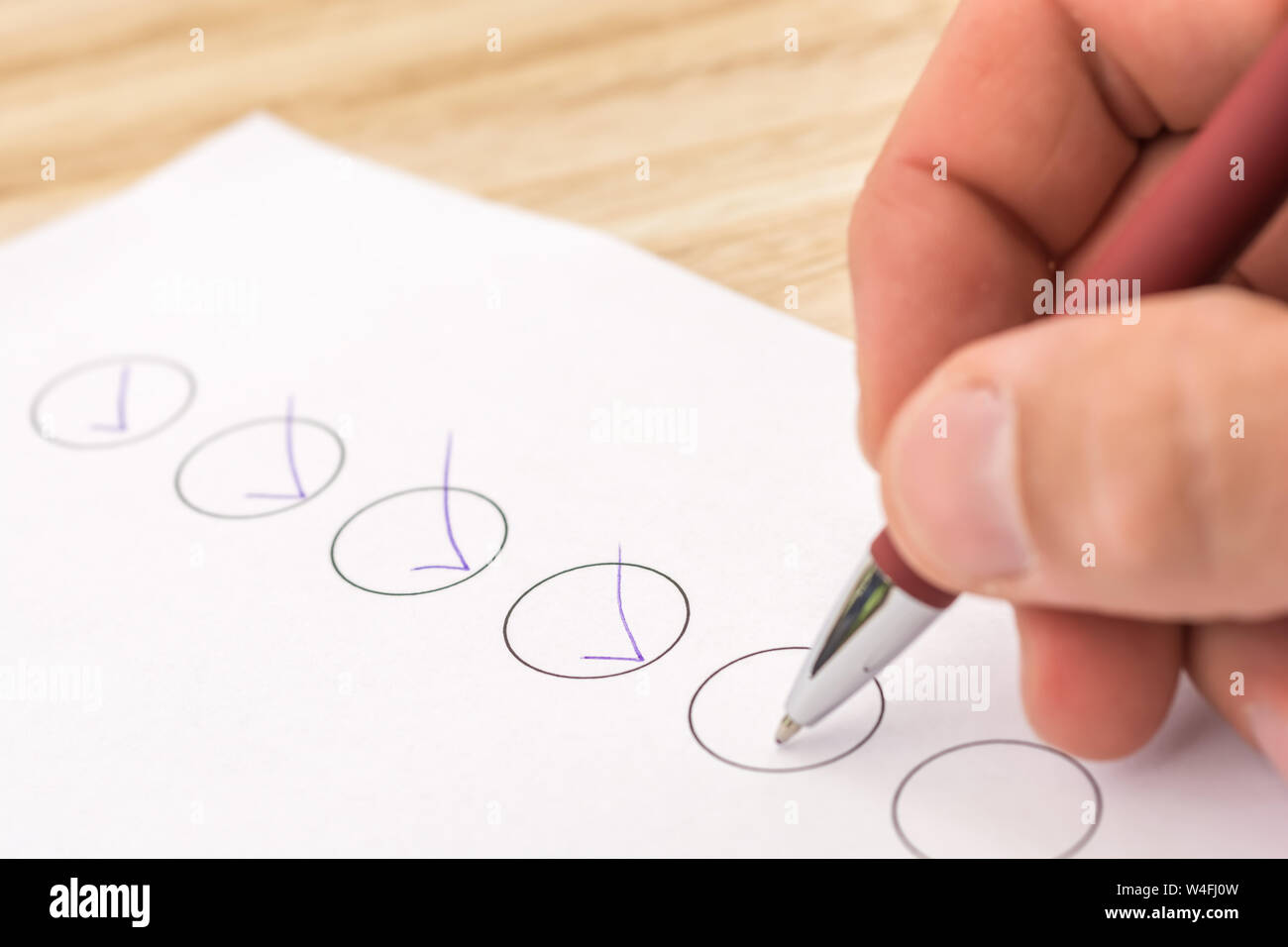 Checklist is ticked off on a desk Stock Photo