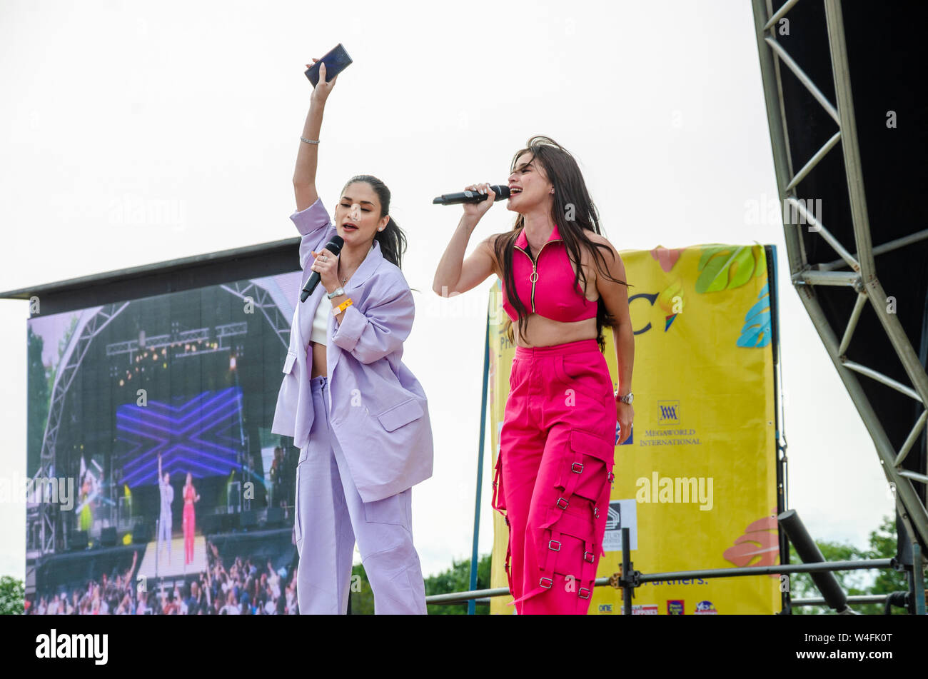 Filipino artists Pia Wurtzback and Anne Curtis perform on stage at a Filipino cultural event in London, UK Stock Photo