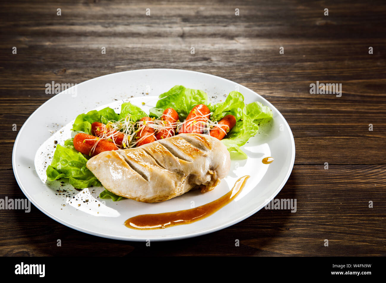 Grilled chicken fillet and vegetables Stock Photo