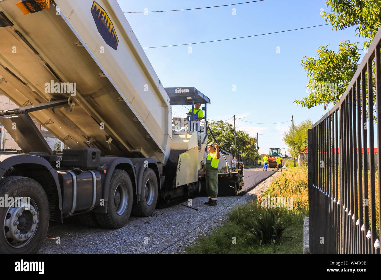 Industrial truck laying fresh bitumen hi-res stock photography and ...