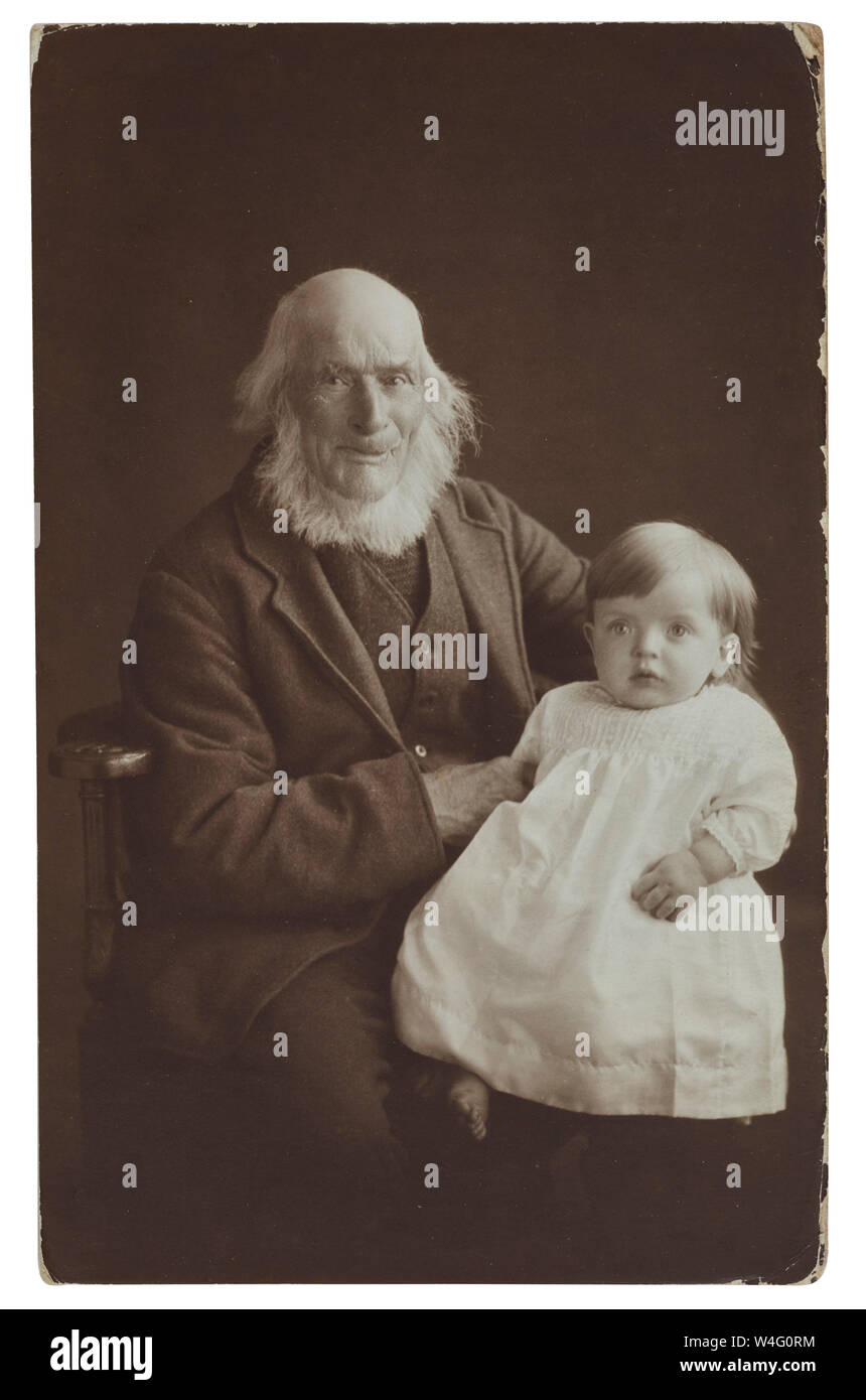 Old man possibly surname of Procter with white beard holding a small baby in an Ipswich photographed Whitfield Cosser and Co 43 Carr Street Stock Photo