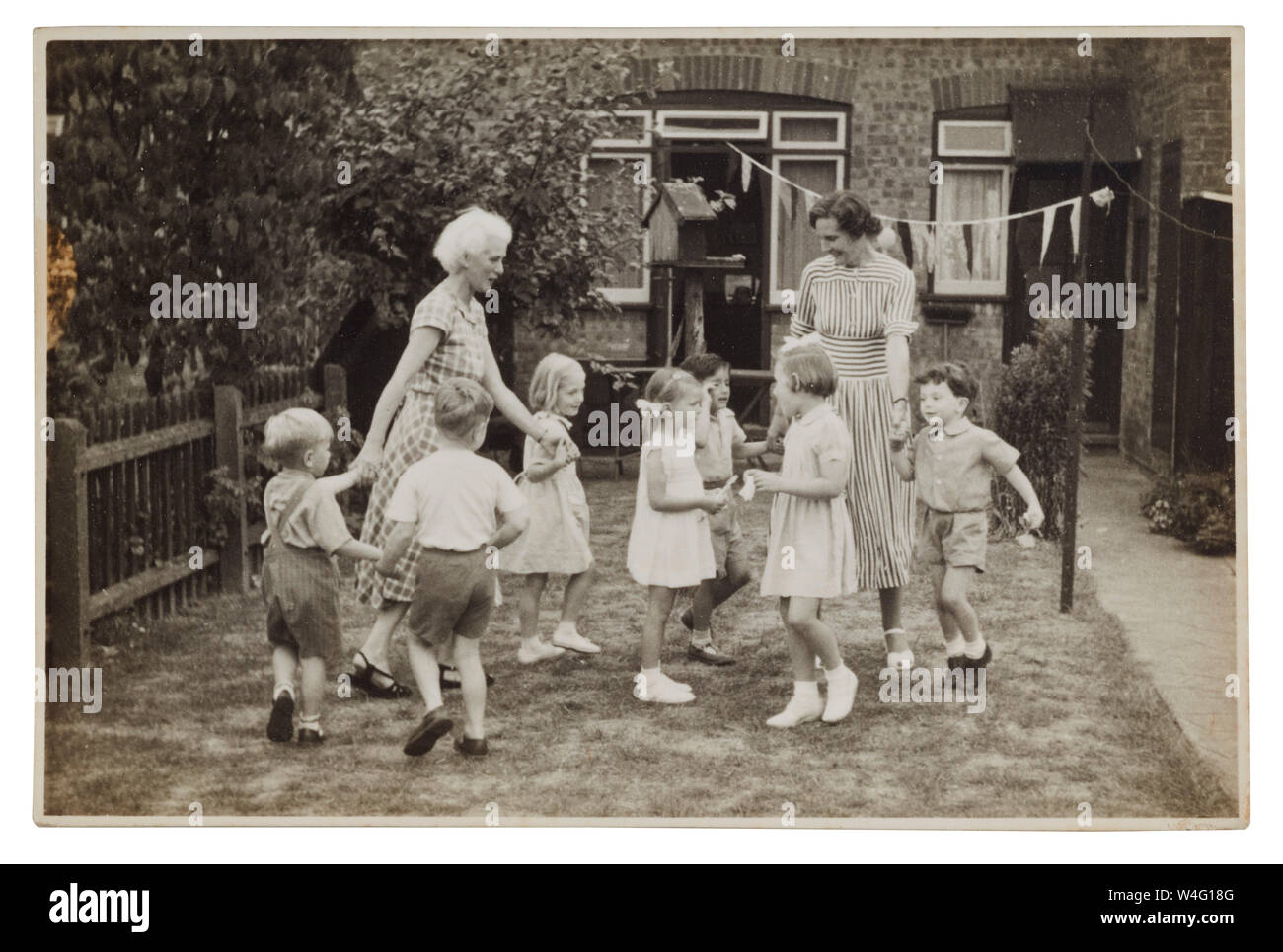 Miss Alice Day With White Hair Leads Children In Ring A Ring Of