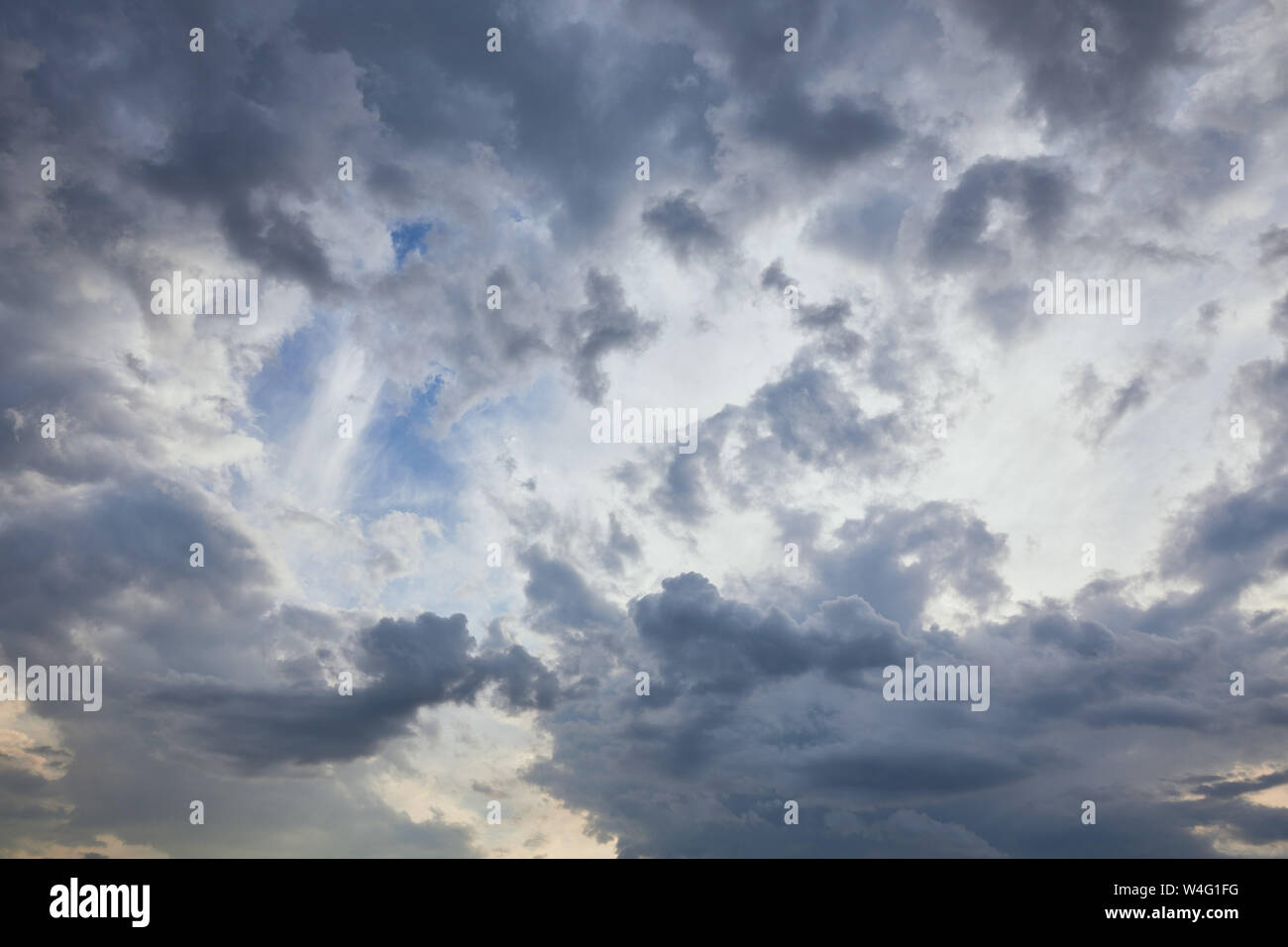 dark clouds on blue sky background Stock Photo - Alamy
