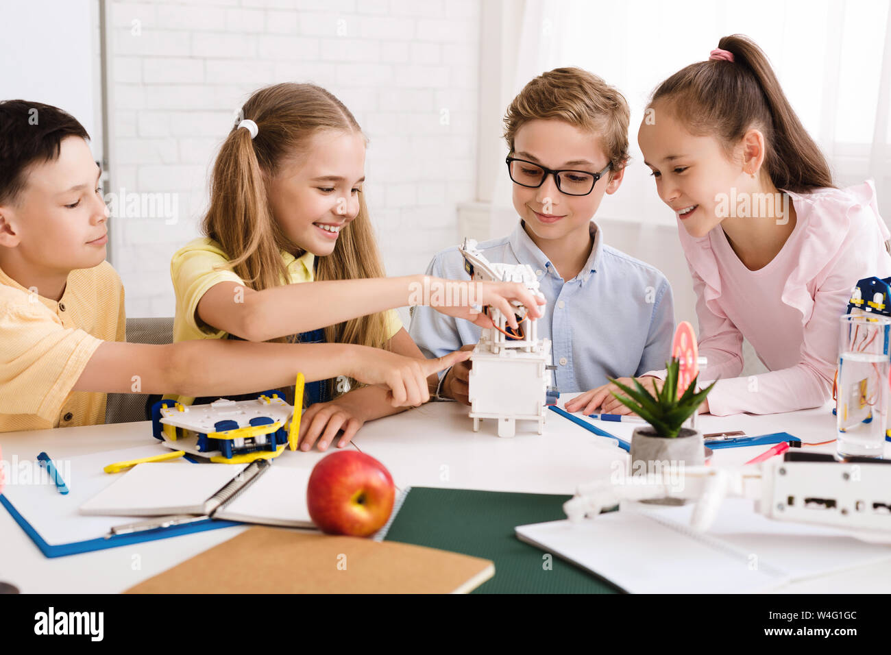 Schoolchildren with diy robot on stem education class Stock Photo - Alamy