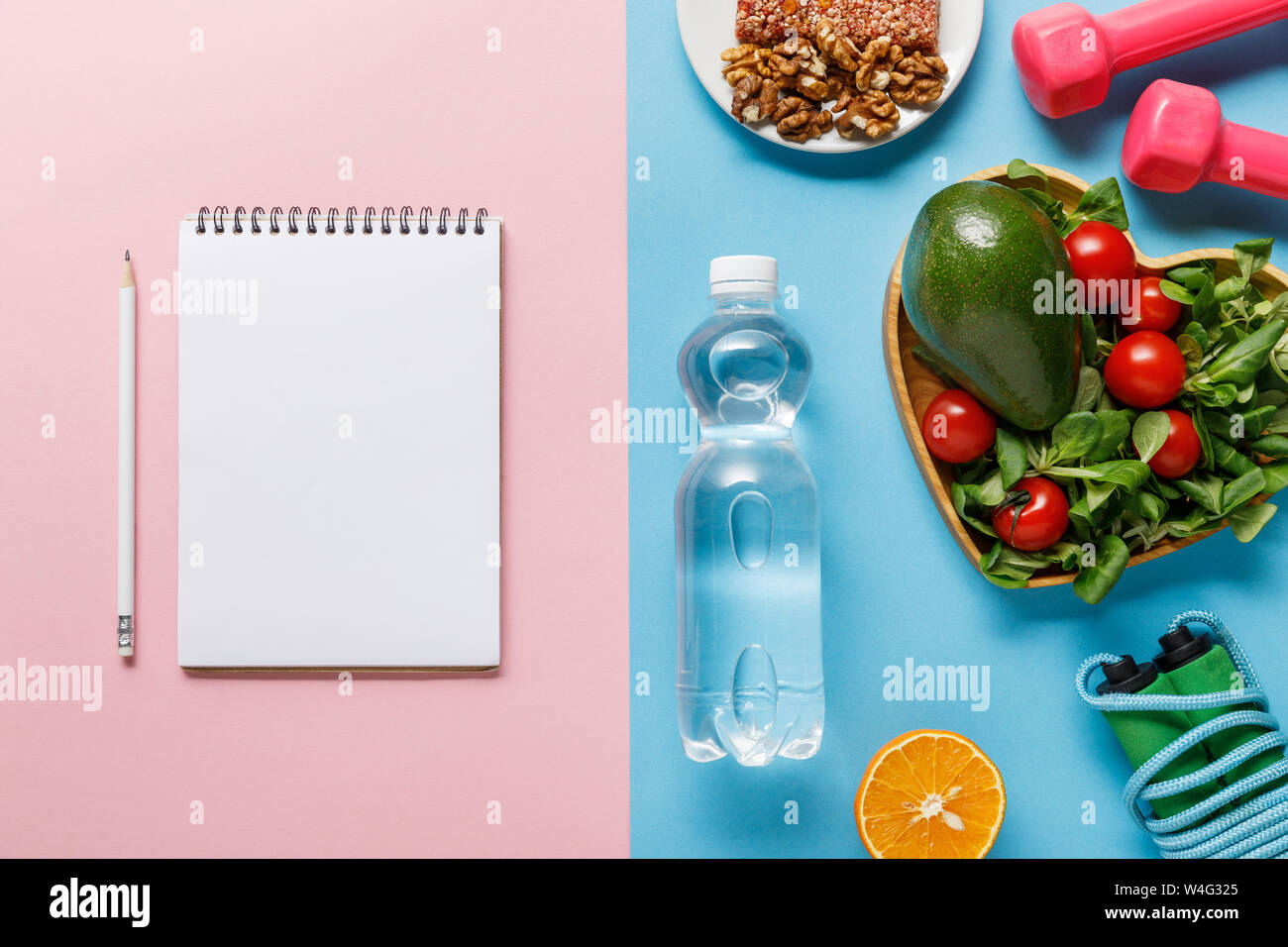 Download Top View Of Bottle With Water Diet Food Sport Equipment And Blank Notebook On Blue And Pink Background Stock Photo Alamy PSD Mockup Templates