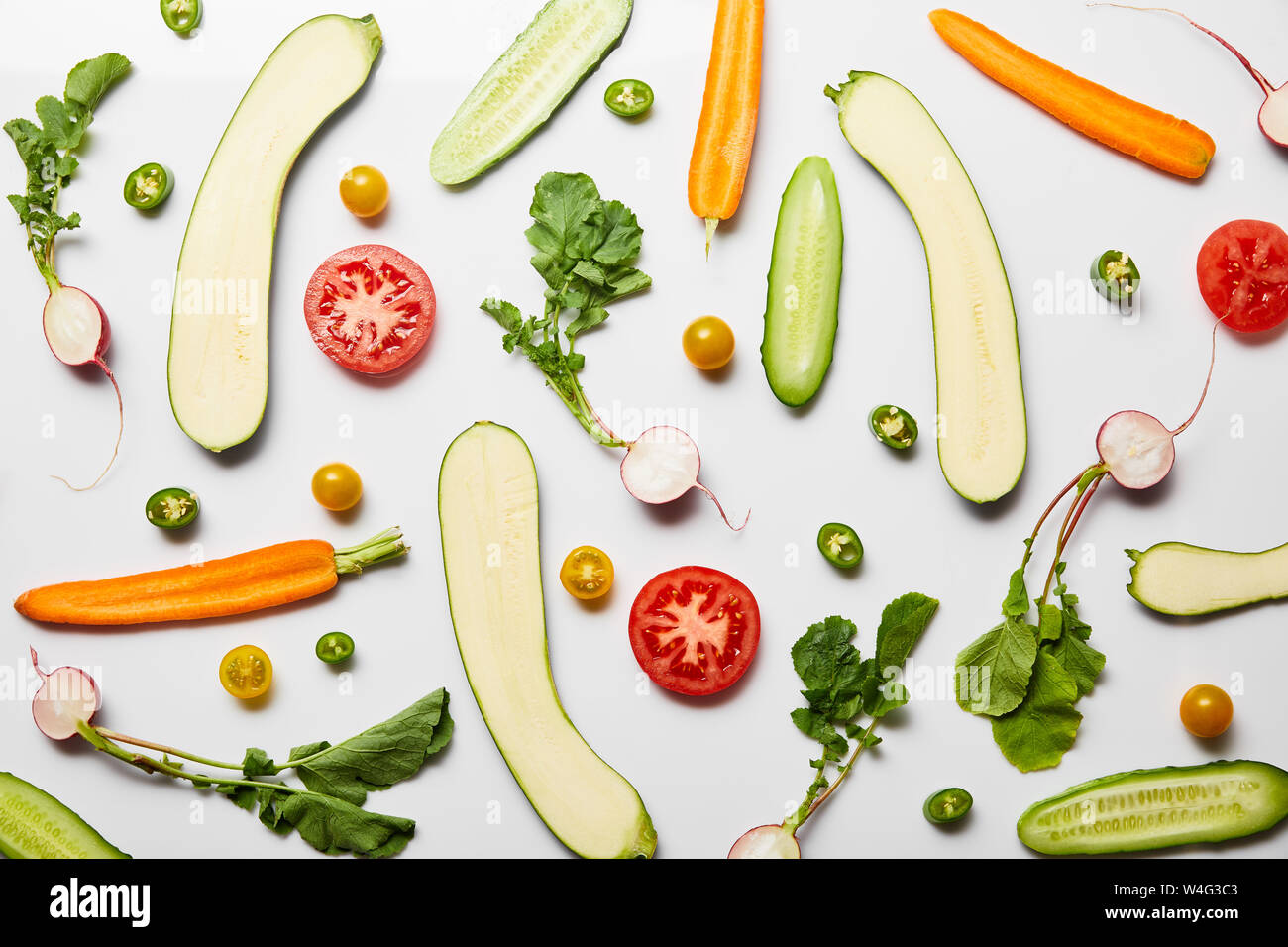 top view of fresh sliced vegetables on white background Stock Photo - Alamy