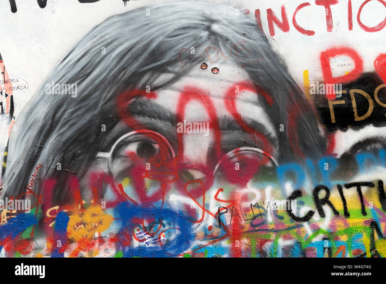 PRAGUE, JULY 15 2019 - Beatles John Lennon graffiti wall is symbol of freedom and artist from all over the world keep on writing on it Stock Photo