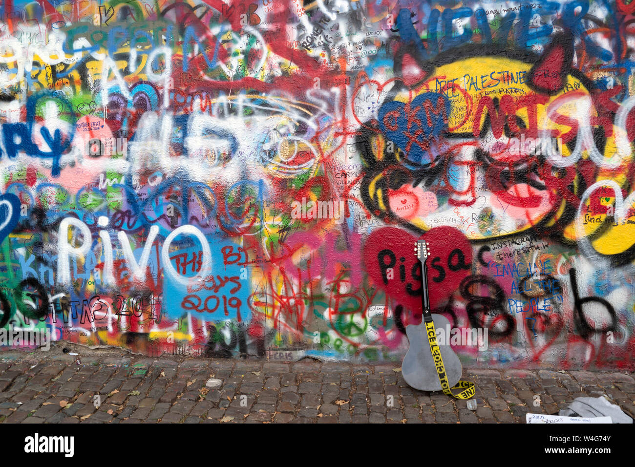 PRAGUE, JULY 15 2019 - Beatles John Lennon graffiti wall is symbol of freedom and artist from all over the world keep on writing on it Stock Photo