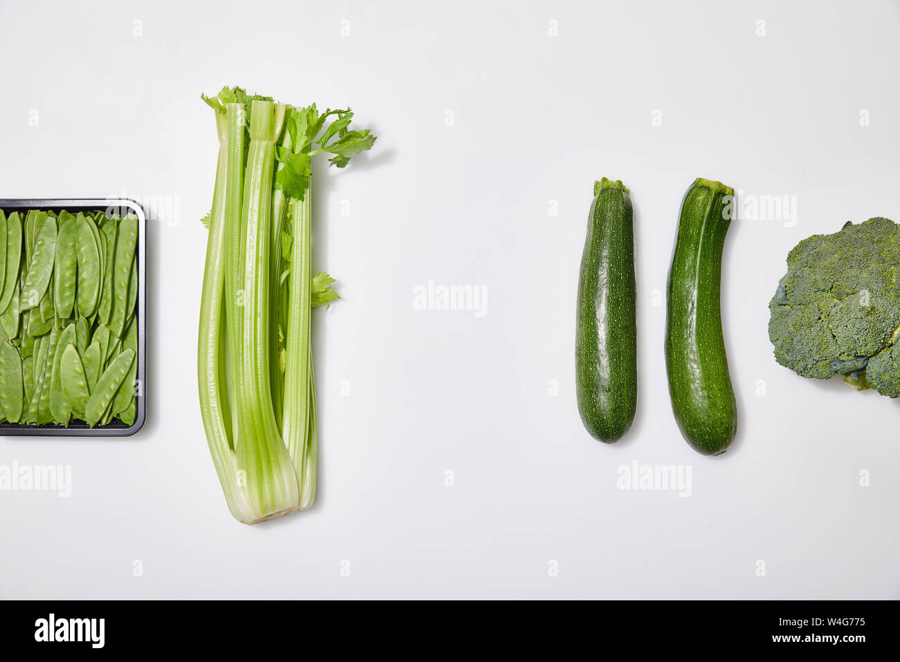 top view of green fresh vegetables on white background Stock Photo - Alamy