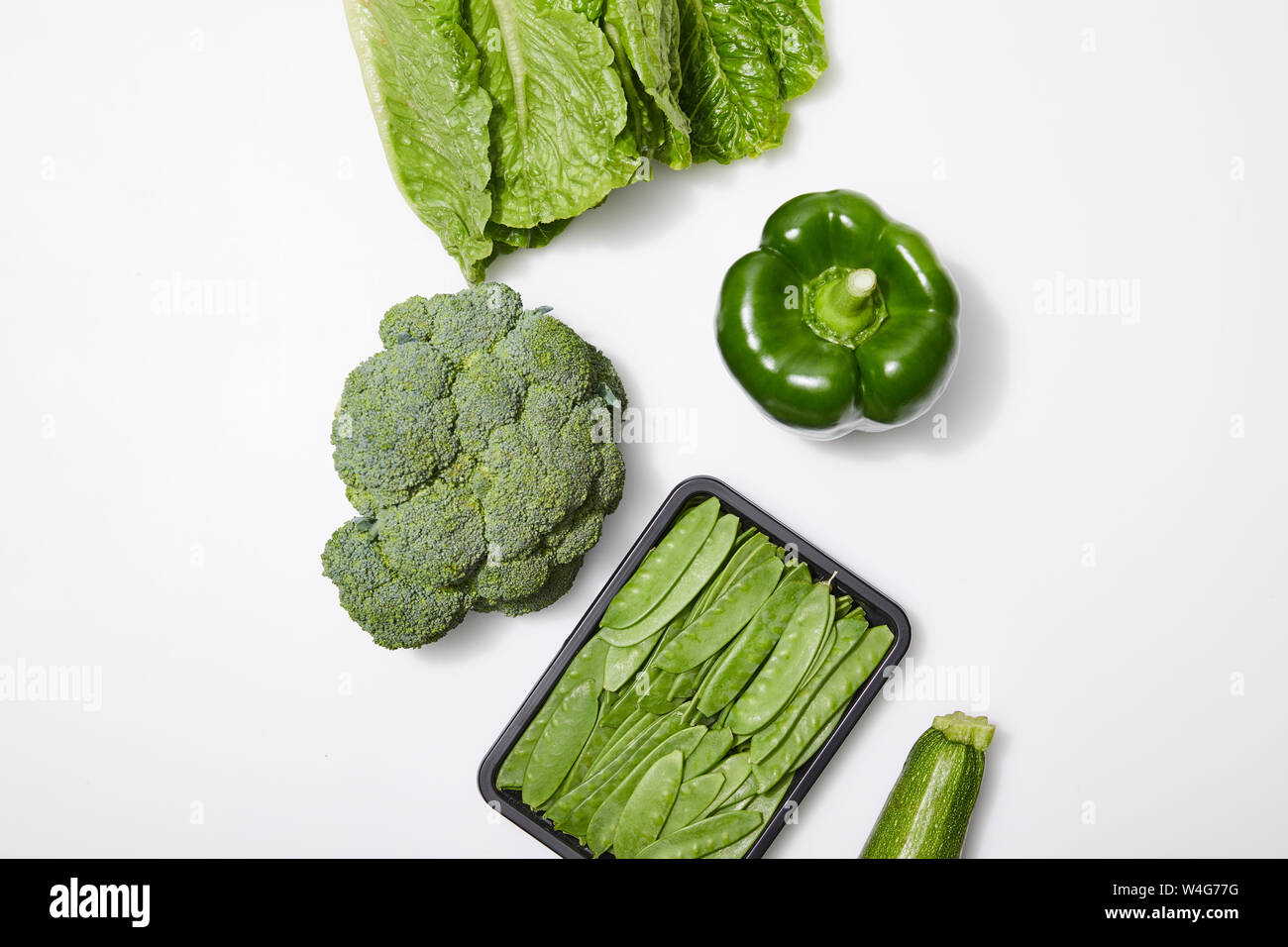 top view of green organic vegetables on white background Stock Photo ...