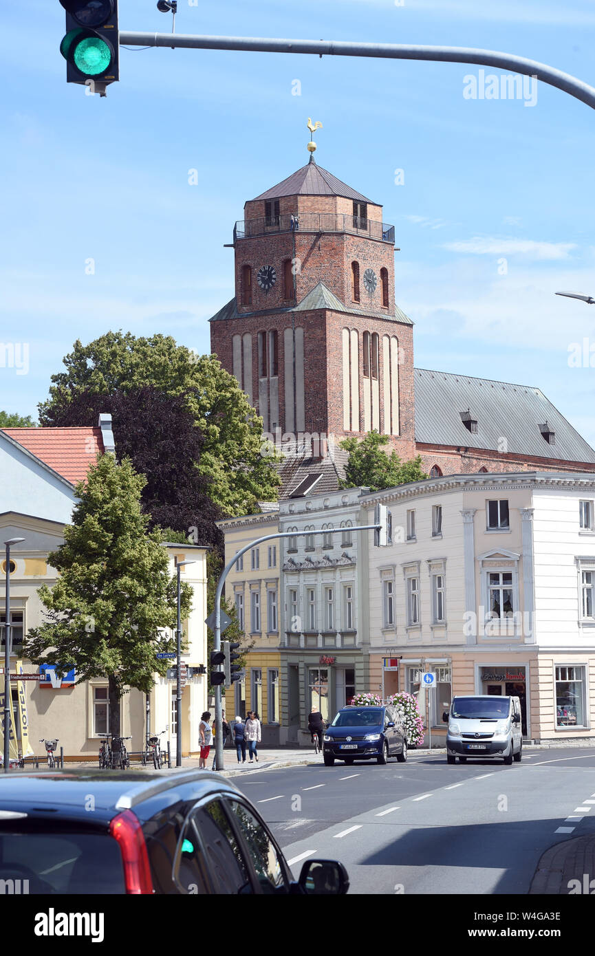10 July 2019, Mecklenburg-Western Pomerania, Wolgast: View of the tower of the city church St. Petri von Wolgast. Built in the 14th century as a large three-nave basilica, the church towers above the houses of the town in Eastern Pomerania. The town on the Peene river to the island of Usedom has around 13,000 inhabitants. In 1282 the town was granted the town charter according to the Lübeck model. Photo: Stefan Sauer/dpa-Zentralbild/ZB Stock Photo
