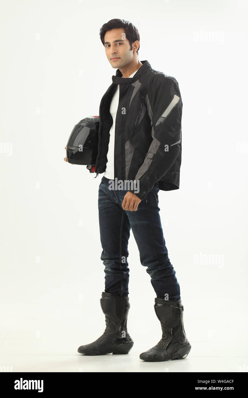 Man carrying crash helmet hi-res stock photography and images - Alamy