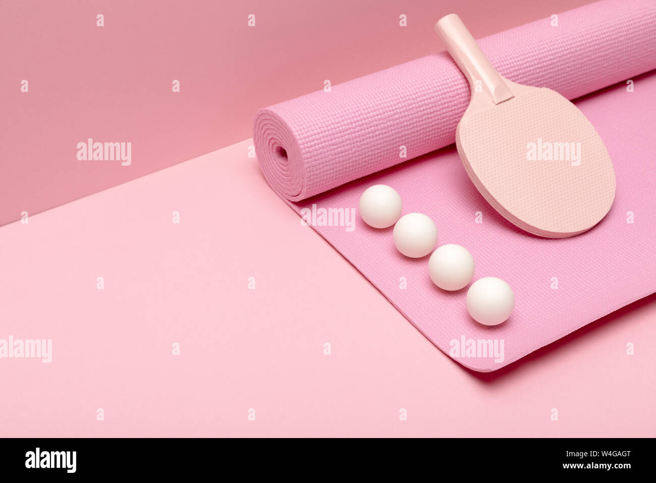 Flat Lay With White Ping Pong Balls And Racket On Fitness Mat On