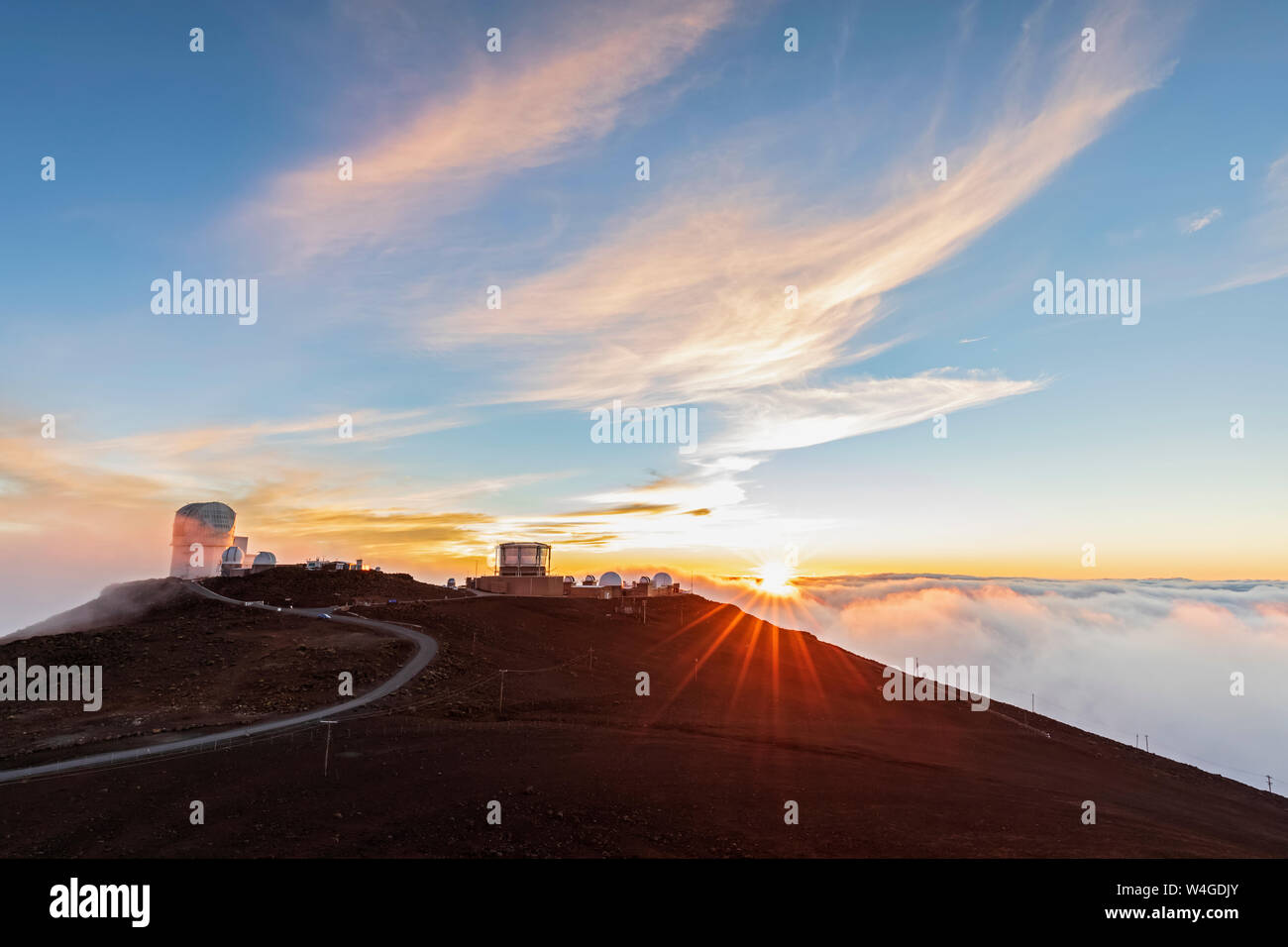 View from Red Hill summit to Haleakala Observatory at sunset, Maui, Hawaii, USA Stock Photo