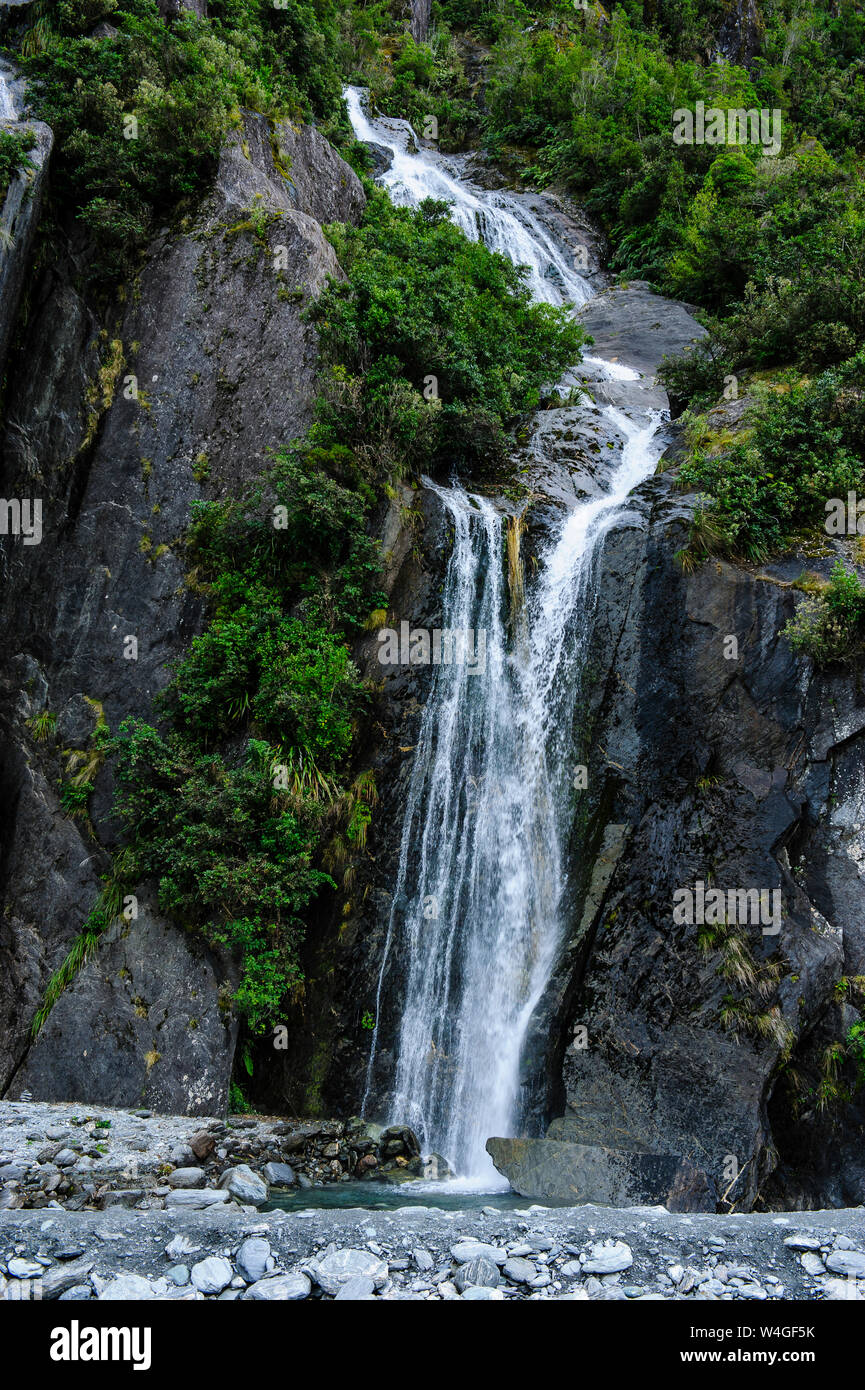 Huge waterfall on the bottom of the Franz Josef Glacier, South Island, New Zealand Stock Photo