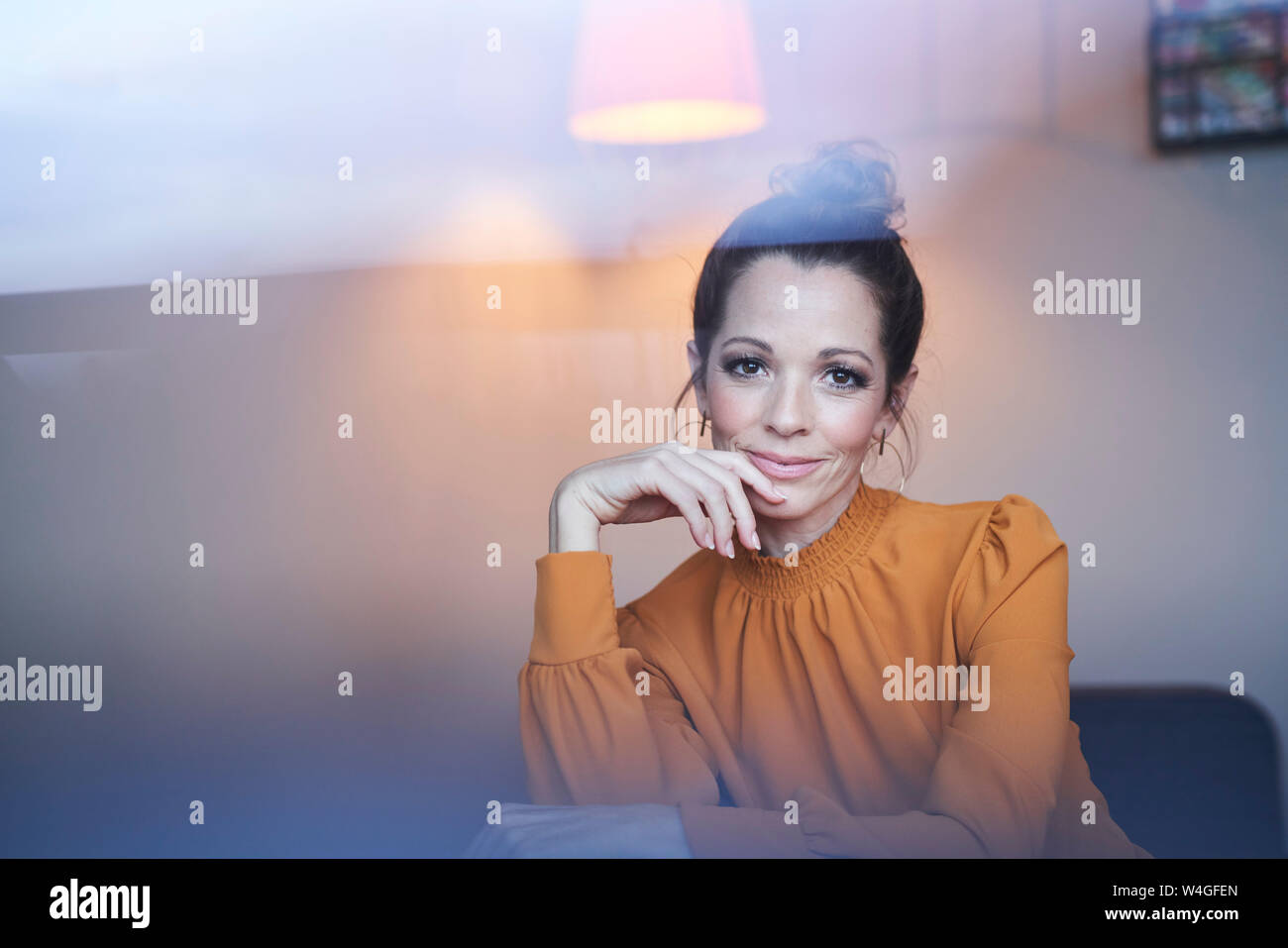 Portrait of smiling woman at home Stock Photo - Alamy