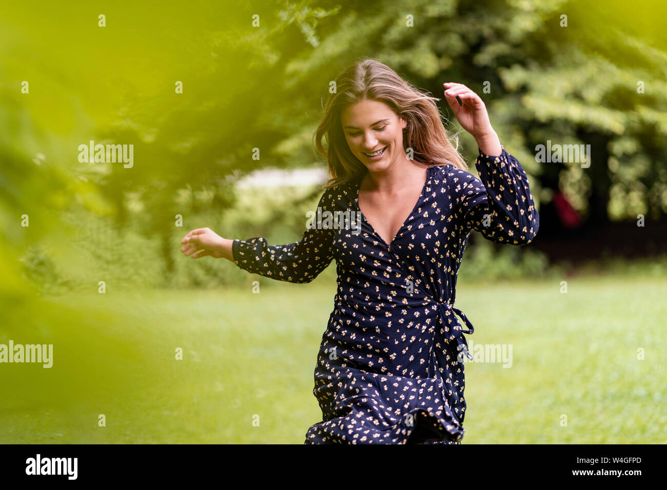 Woman running dress park hi-res stock photography and images - Alamy