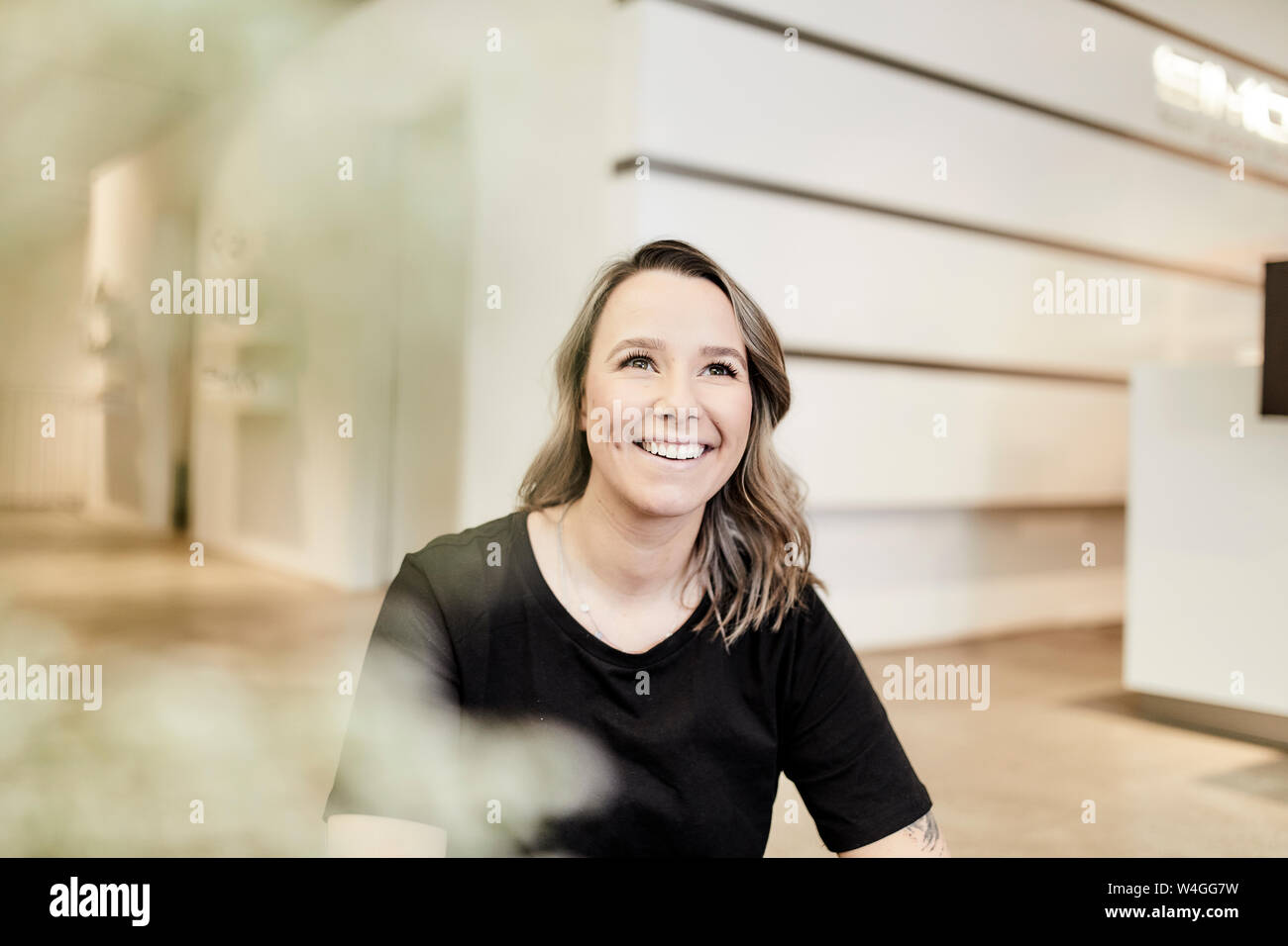 Portrait of smiling young customer consultant Stock Photo