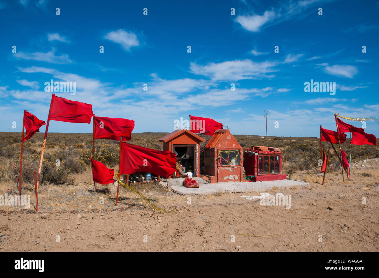 Red flags and a memorial, Valdes Peninsula, Argentina, South America Stock Photo