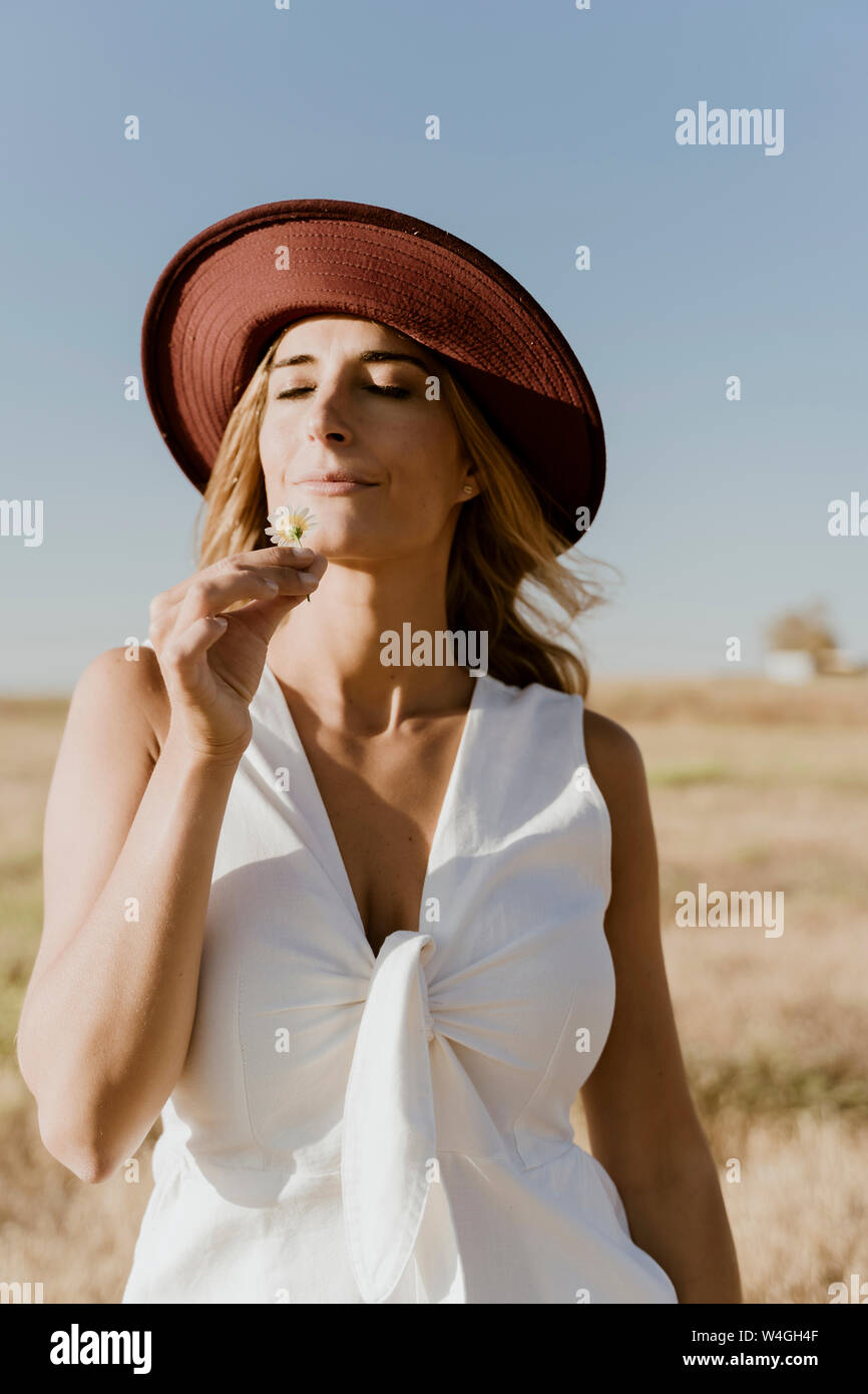 Portrait of female traveller with straw hat Stock Photo