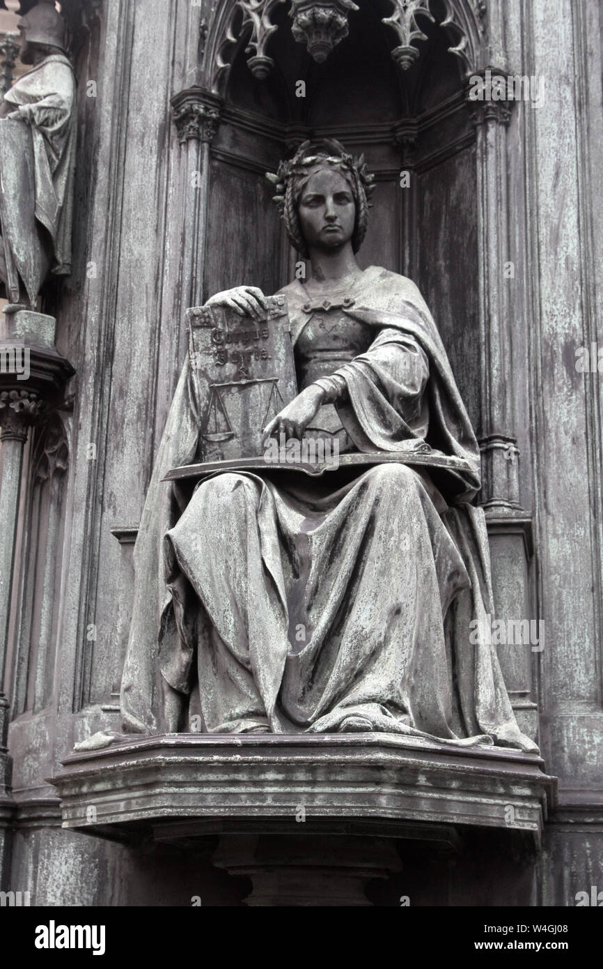 statue of Themis, the scales of justice and the letter of law. Themis in Greek mythology the