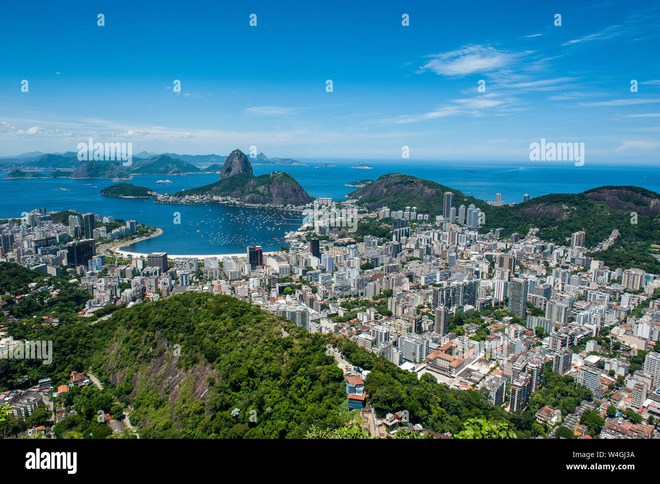 Outlook from the Christ the Redeemer statue over Rio de Janeiro with Sugarloaf Mountain, Brazil Stock Photo