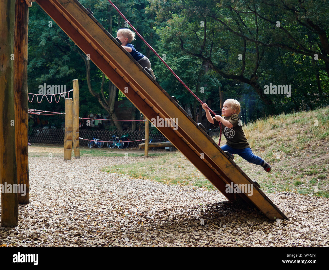 Two little boys having fun on playground Stock Photo