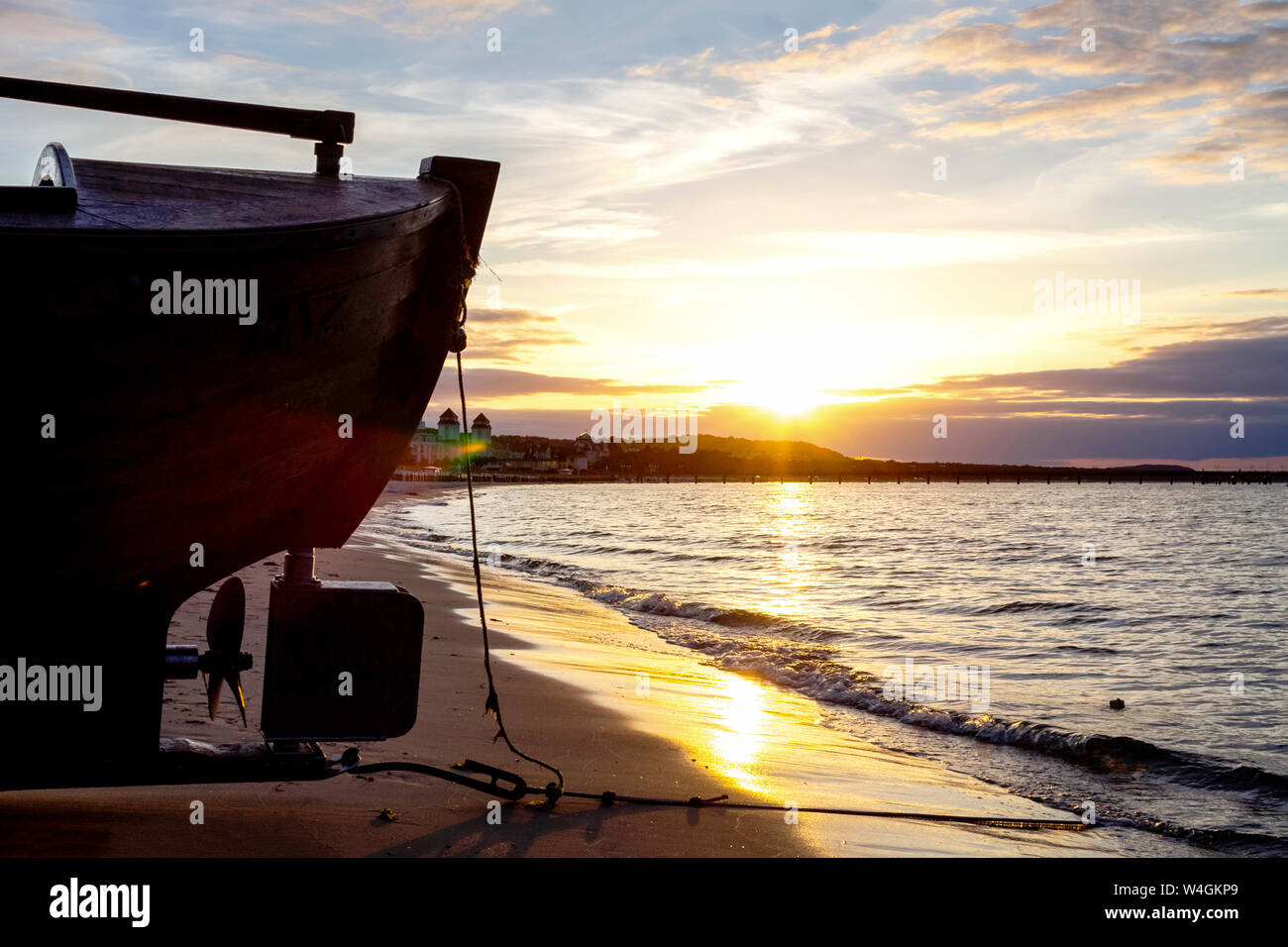 Boat on the beach at twilight, Binz, Ruegen, Germany Stock Photo