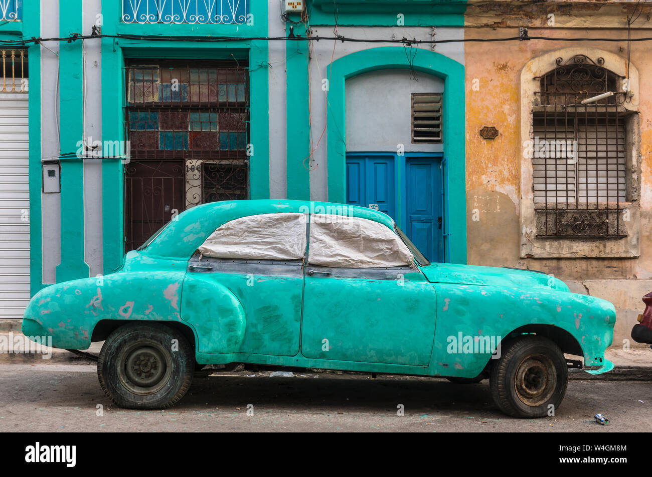 Parked damaged vintage car, Havana, Cuba Stock Photo