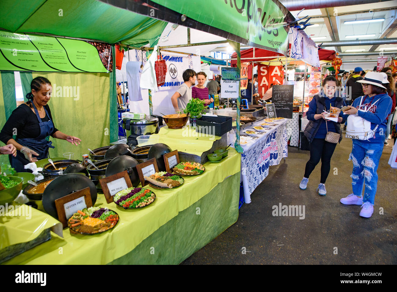 Food stalls in Brick Lane Sunday Market in London, United Kingdom Stock ...