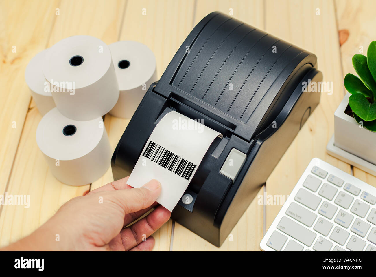 Office equipment, A point of sale receipt printer printing a receipt Stock Photo