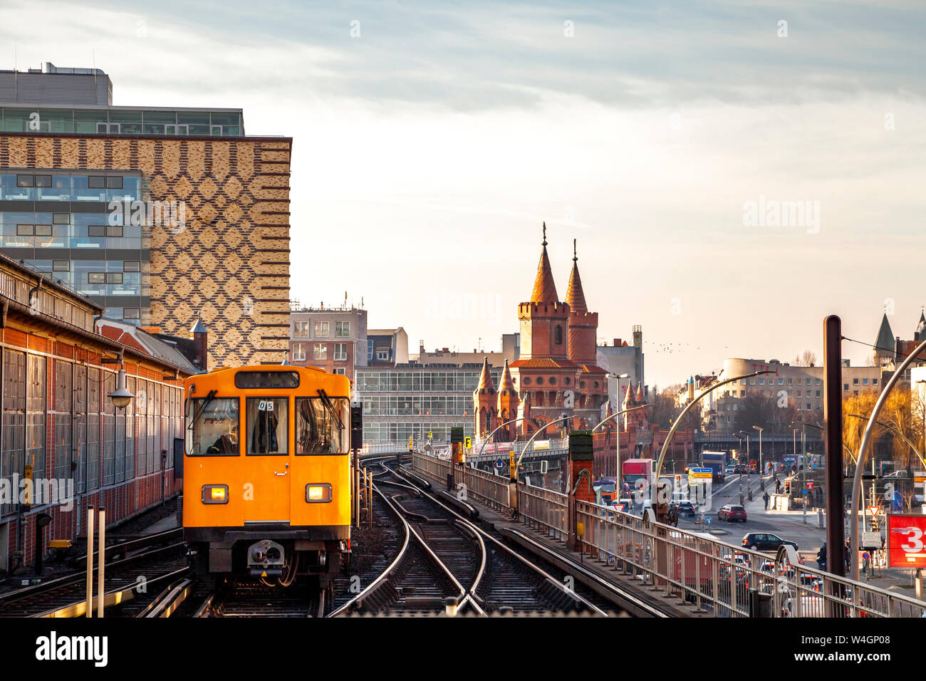 Train in elevated railway in front of Oberbaum Bridge at twilight, Berlin, Germany Stock Photo