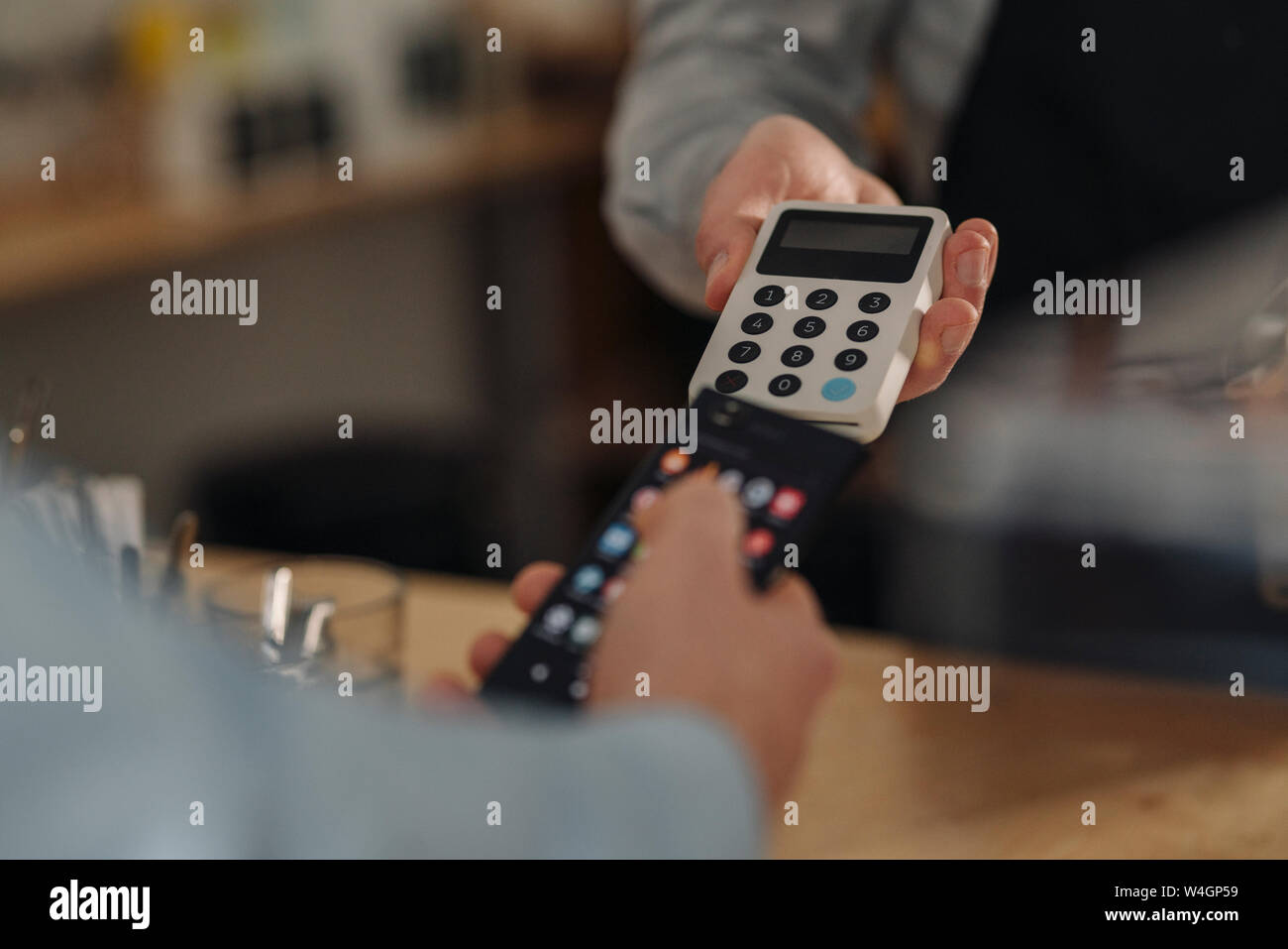 Customer paying contactless in hi-res stock photography and images - Alamy