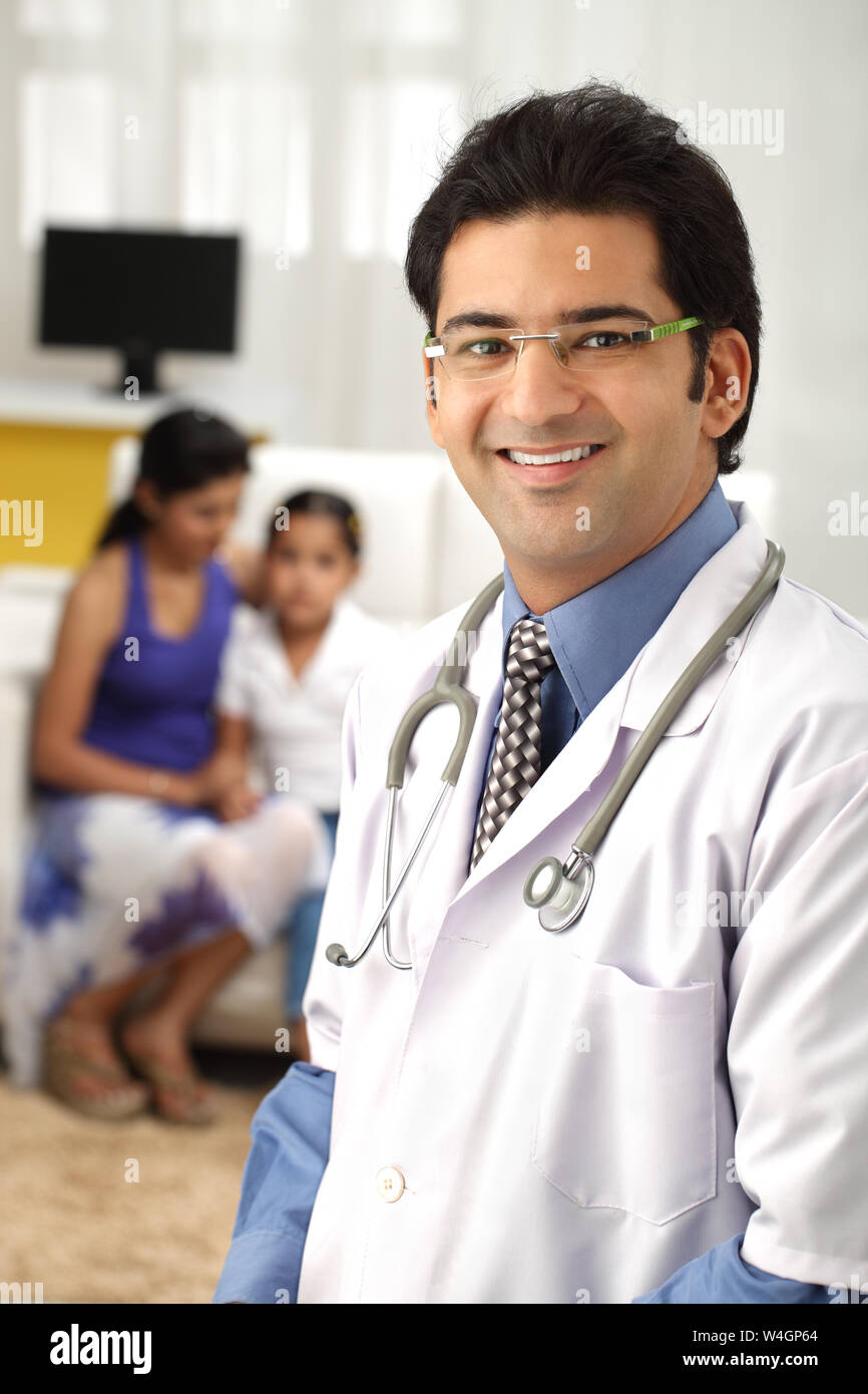 Portrait of a male doctor smiling Stock Photo - Alamy