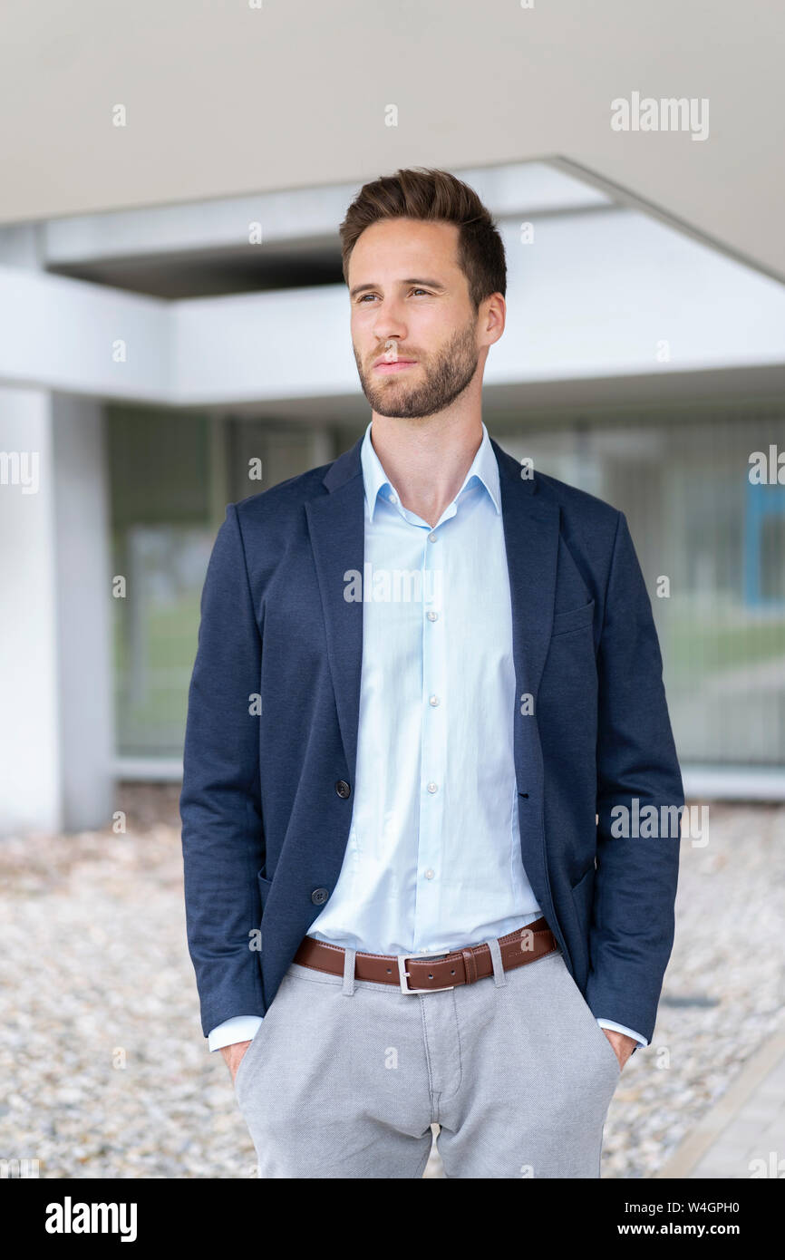 Confident businessman standing outdoors Stock Photo