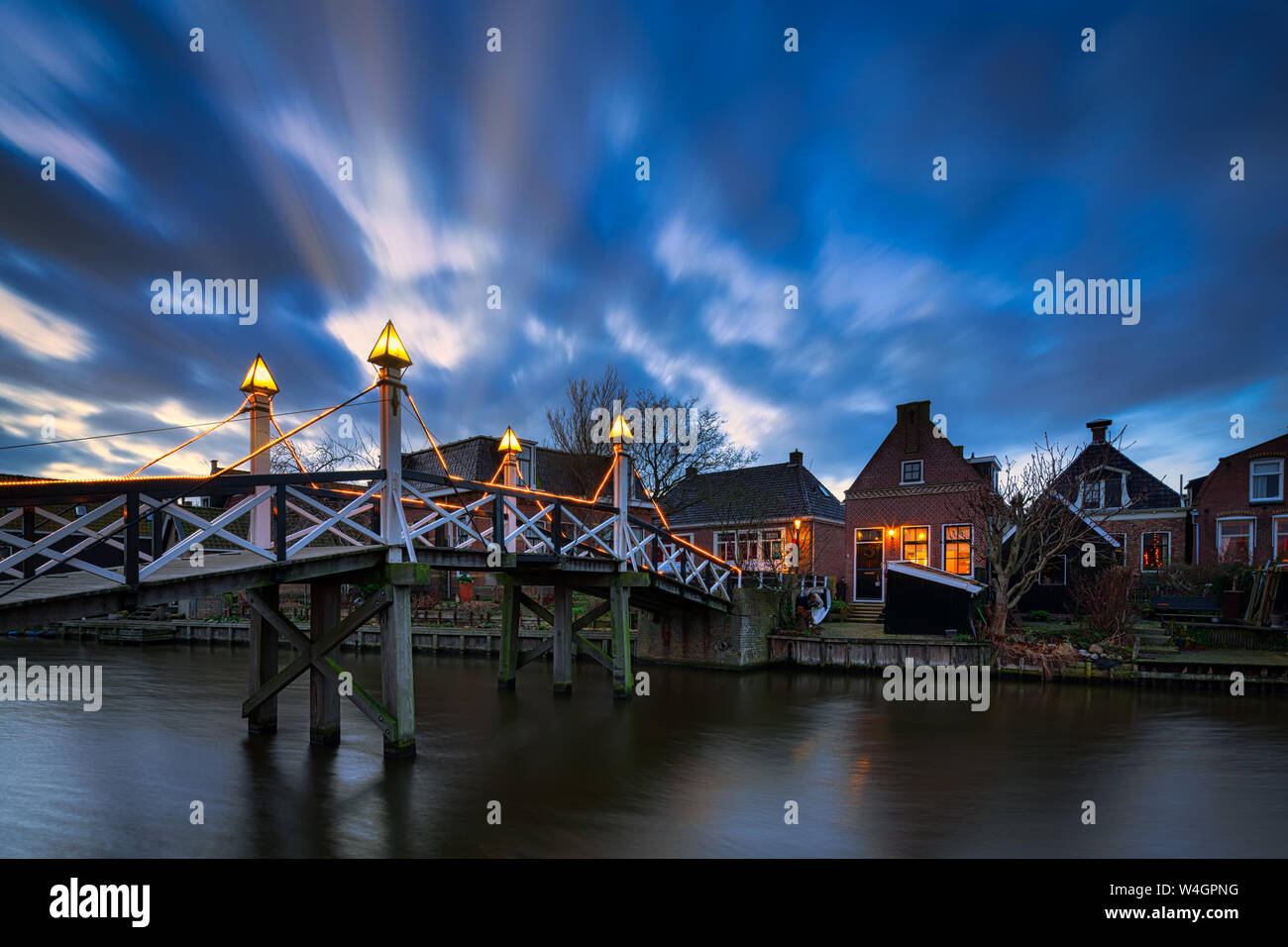 An historic town and popular travel destination in the Netherlands at the IJsselmeer with old houses and canals - Hindeloopen, The Netherlands Stock Photo