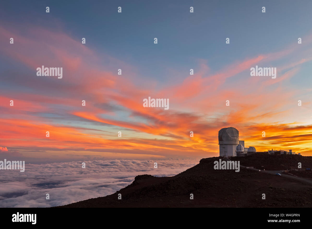 View from Red Hill summit to Haleakala Observatory at dusk, Maui, Hawaii, USA Stock Photo