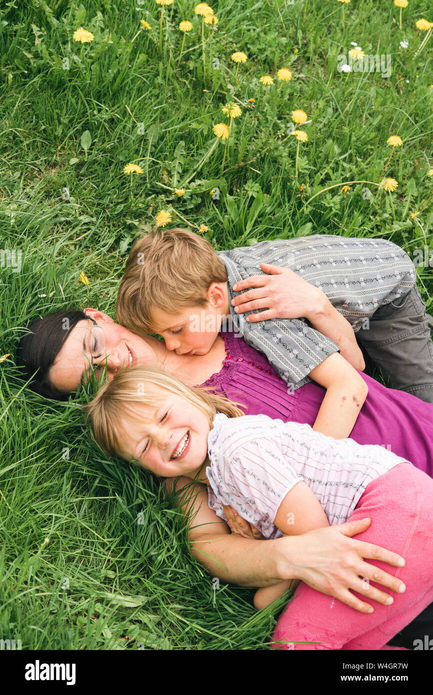 Two children lying hi-res stock photography and images - Alamy