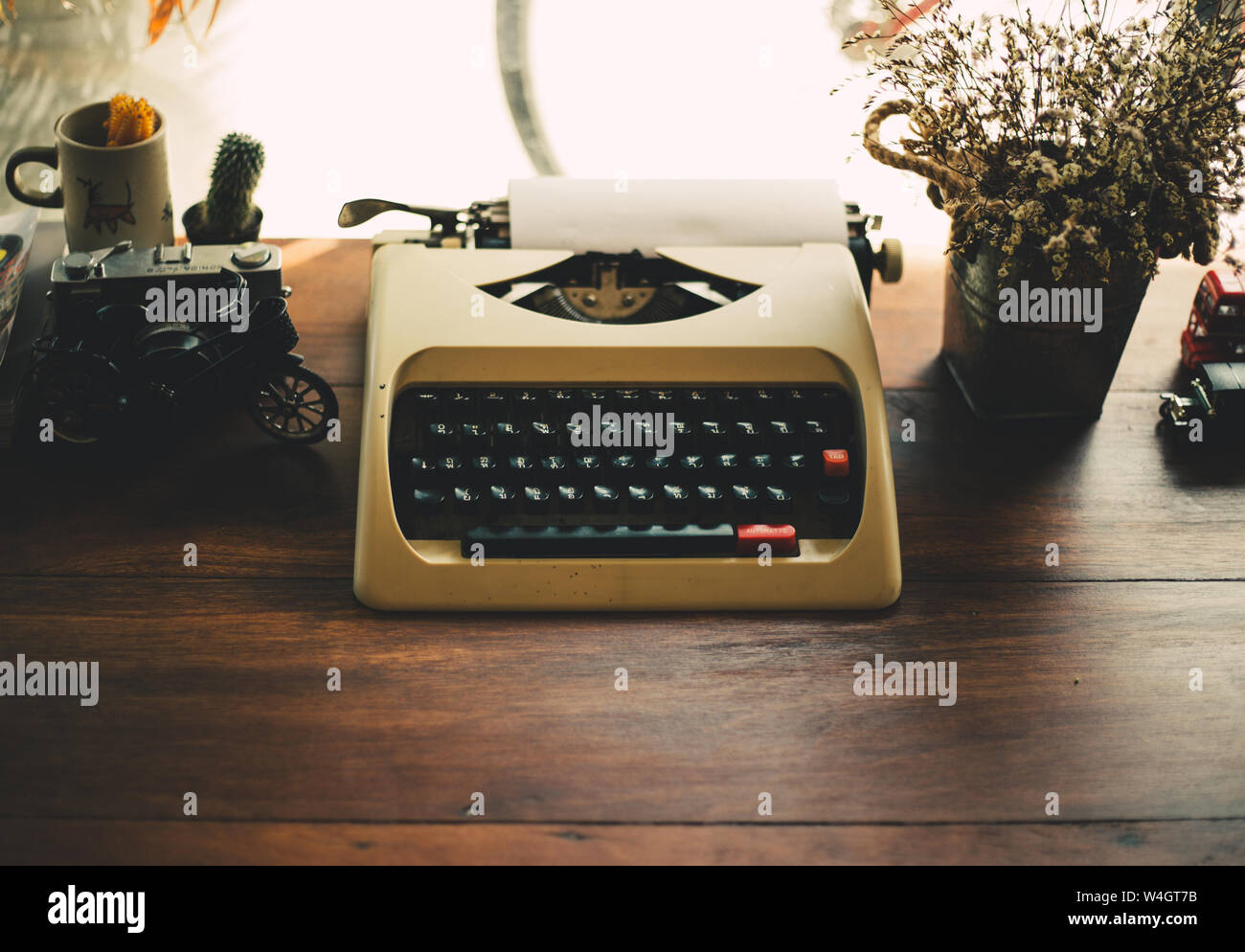 old typewriter on old wooden table Stock Photo