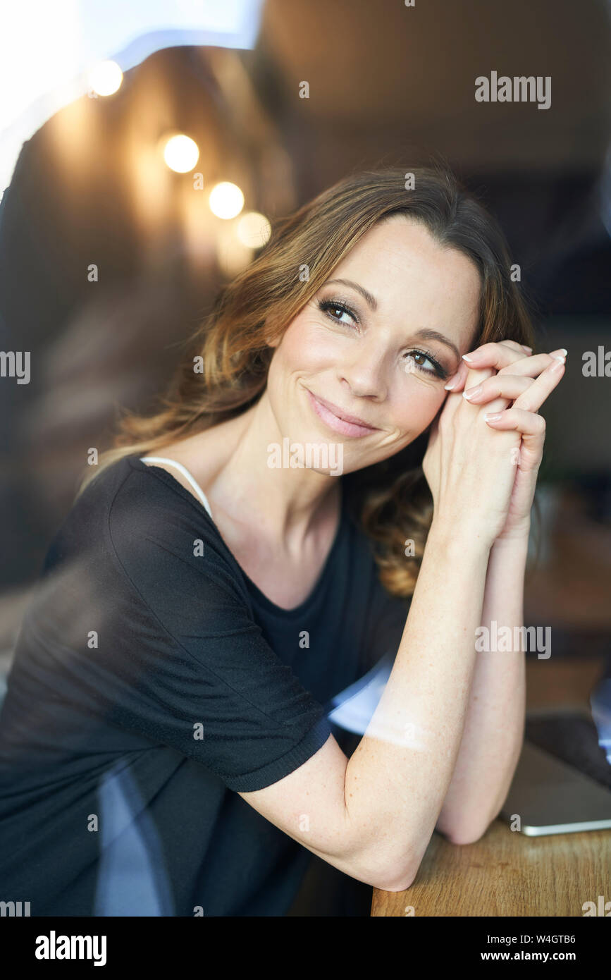 Portrait of brunette woman looking away Stock Photo