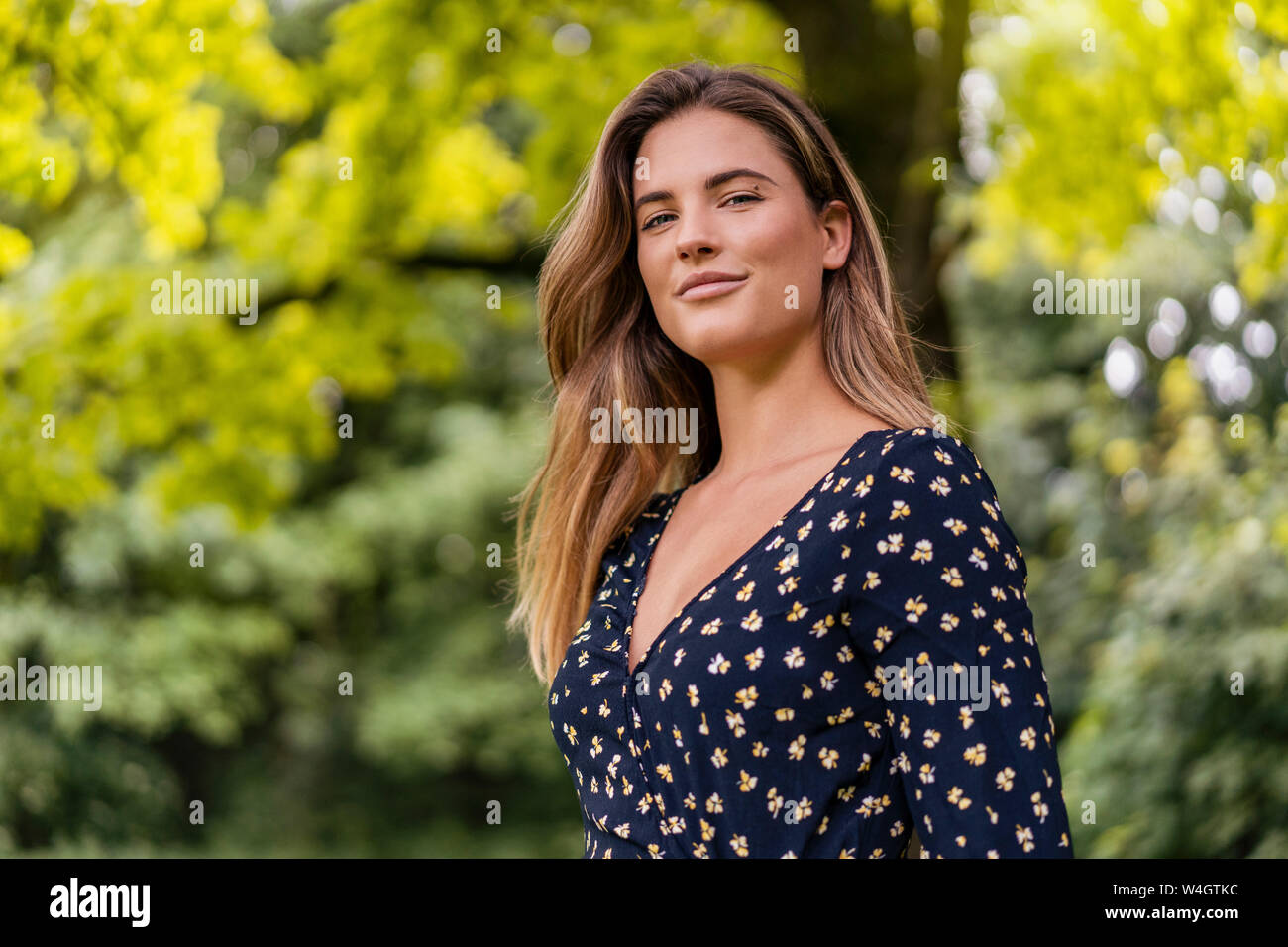 Attractive young smiling woman hi-res stock photography and images - Alamy