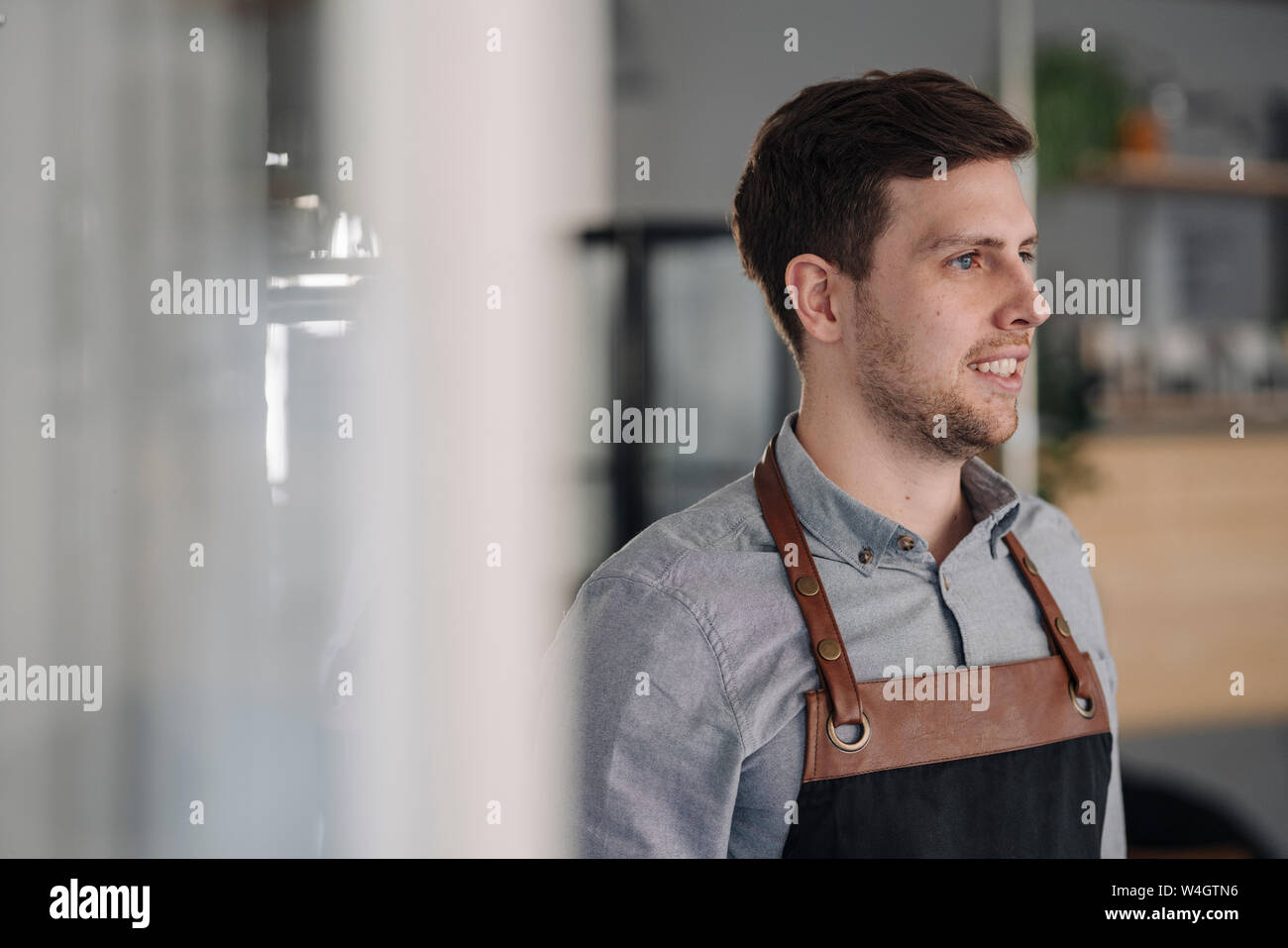 Barista wearing apron hi-res stock photography and images - Alamy
