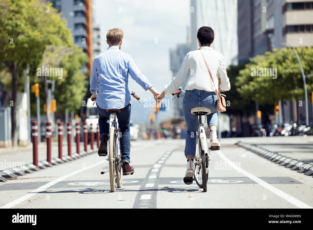 Couple with bikes in Barcelona Stock Photo