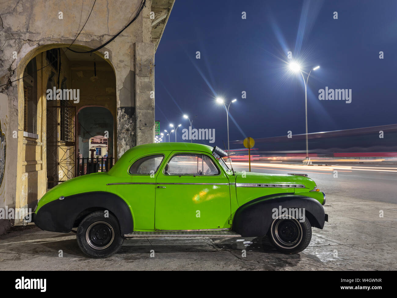 Parked vintage car at night, Havana, Cuba Stock Photo