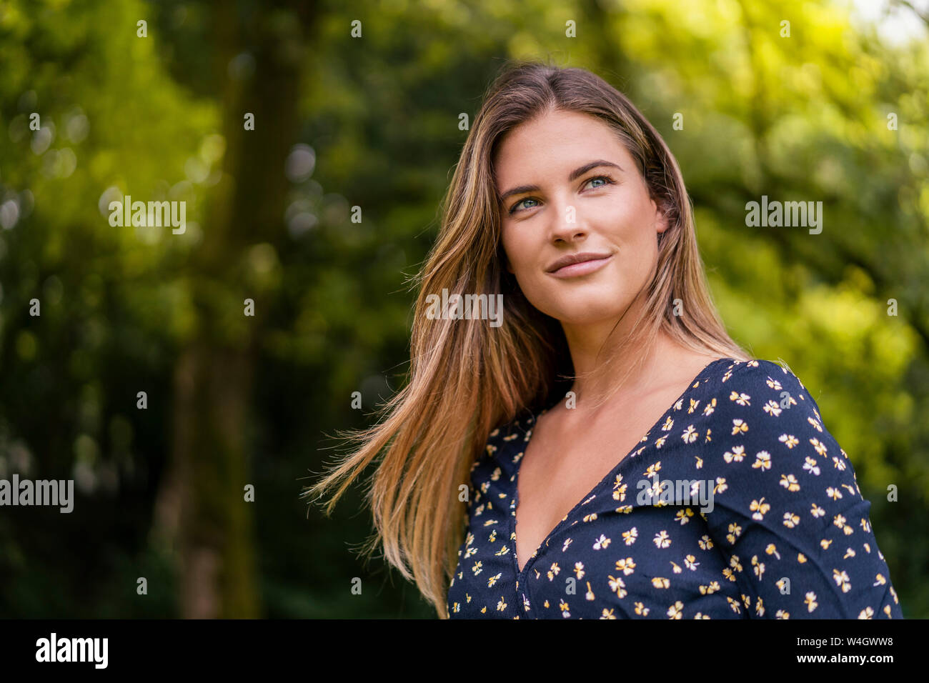 Woman smiling outdoors in park hi-res stock photography and images - Alamy