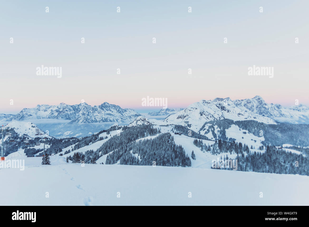 View over snowy mountains at dusk, Saalbach Hinterglemm, Pinzgau, Austria Stock Photo