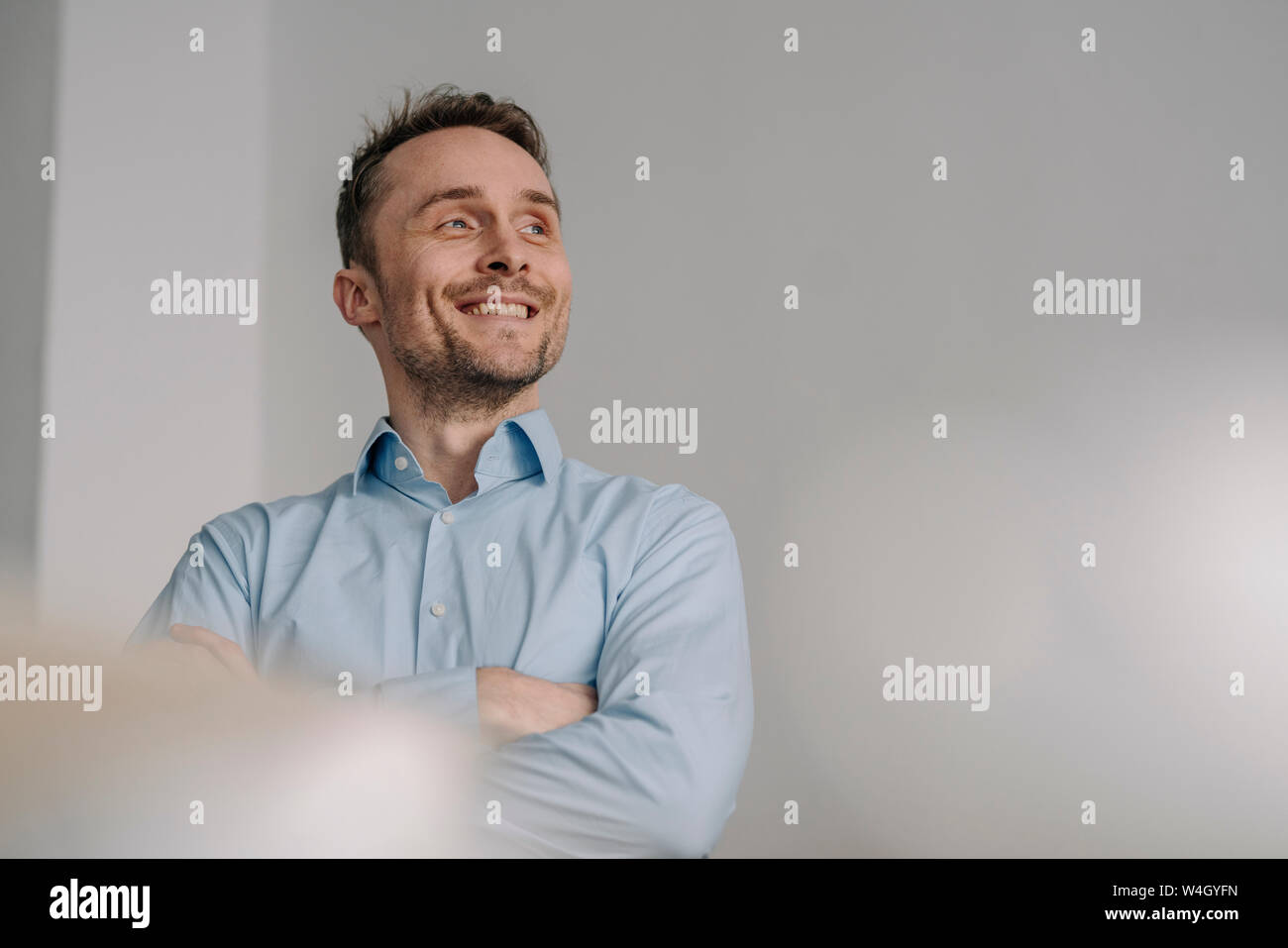 Portrait of a successful businessman, smiling with arms crossed Stock ...