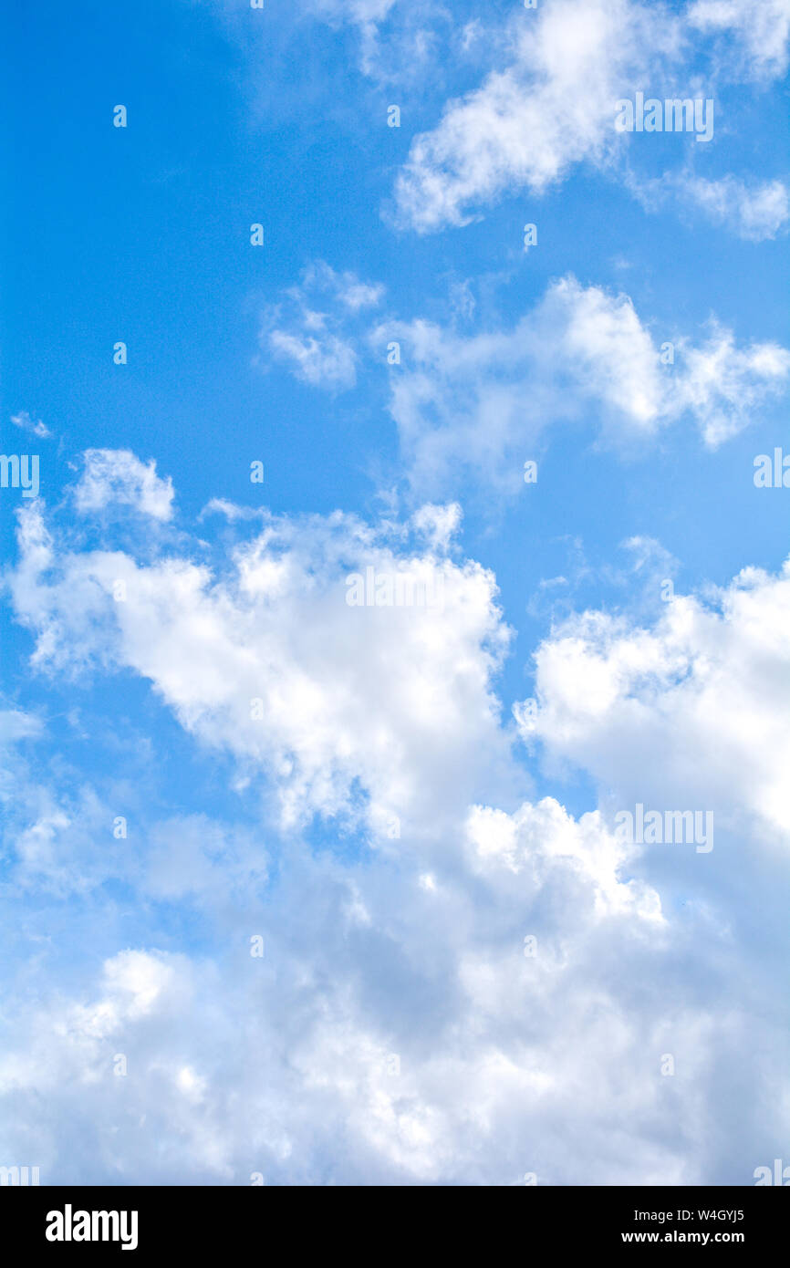 Blue sky background and fluffy white large cloud in sunny day Stock Photo -  Alamy