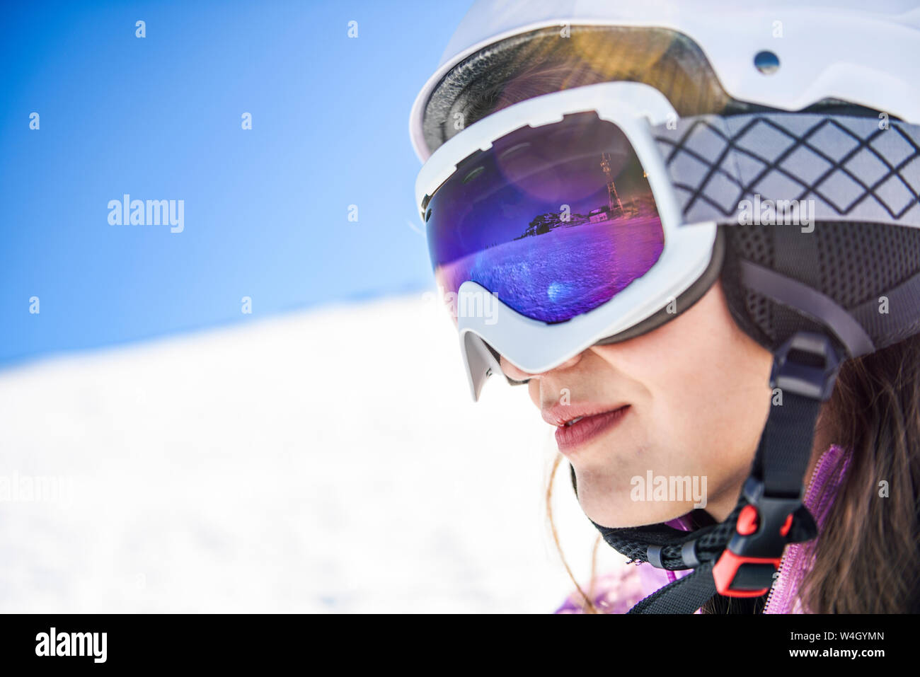 Snowy landscape reflected in ski goggles ofa woman, Sierra Nevada, Andalusia, Spain Stock Photo