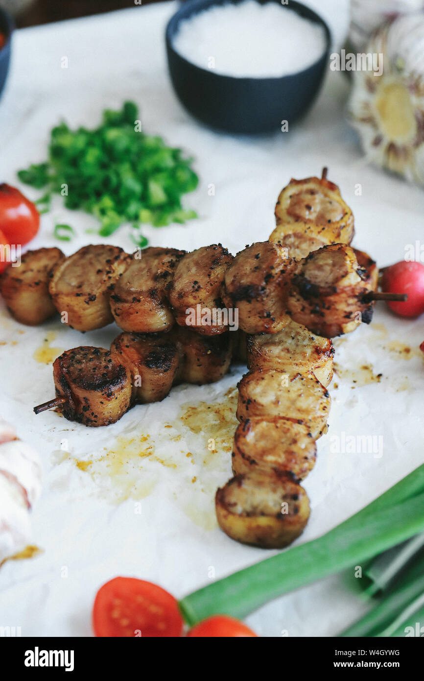 Cooking recipe. Delicious barbecue cooking method with tomatoes Stock Photo